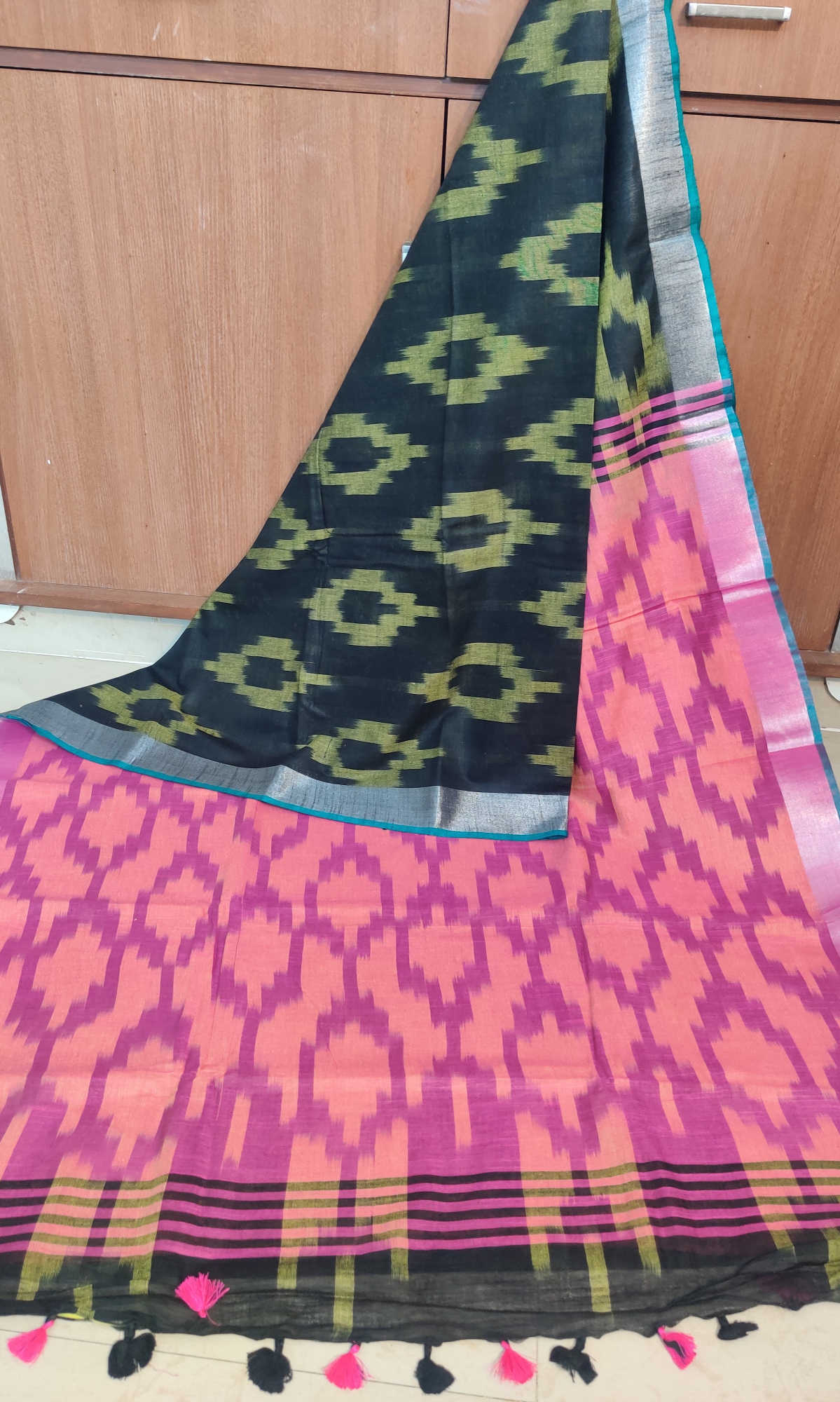 Linen Cotton Saree – Black Ikkat Body with Peach–Pink Ikkat Pallu & Teal Contrast Border