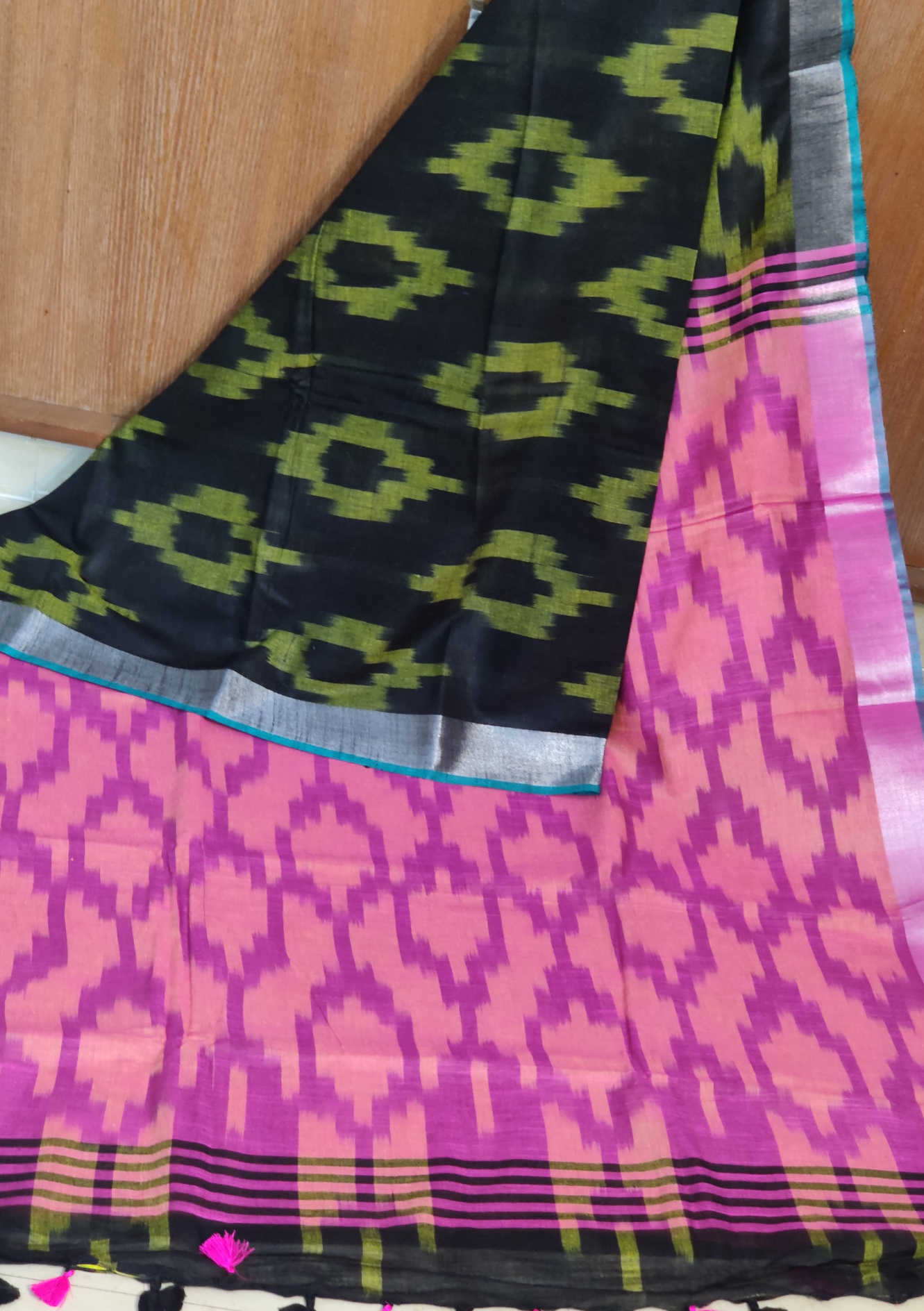 Linen Cotton Saree – Black Ikkat Body with Peach–Pink Ikkat Pallu & Teal Contrast Border