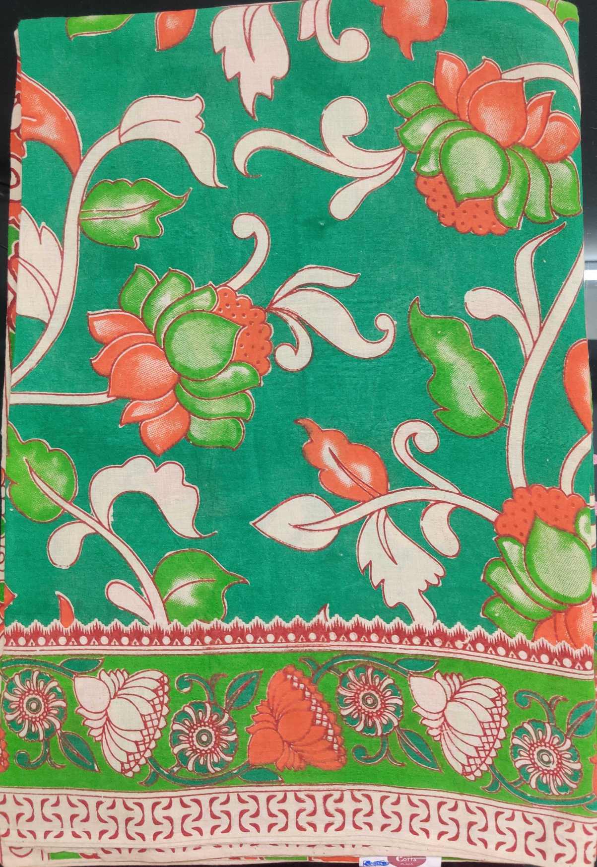 Kalamkari Cotton Saree – Green Body with Orange–White Floral Motifs & Traditional Kalamkari Bird Pallu