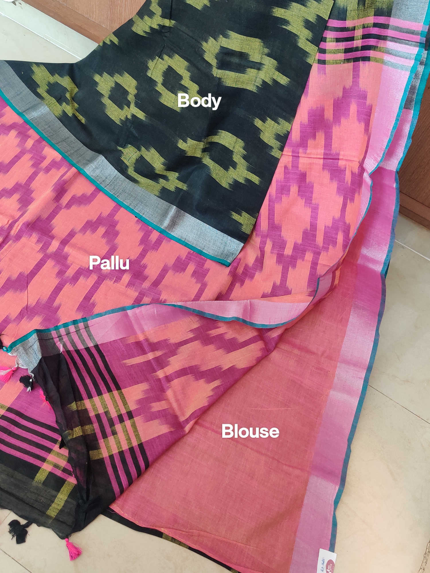Linen Cotton Saree – Black Ikkat Body with Peach–Pink Ikkat Pallu & Teal Contrast Border