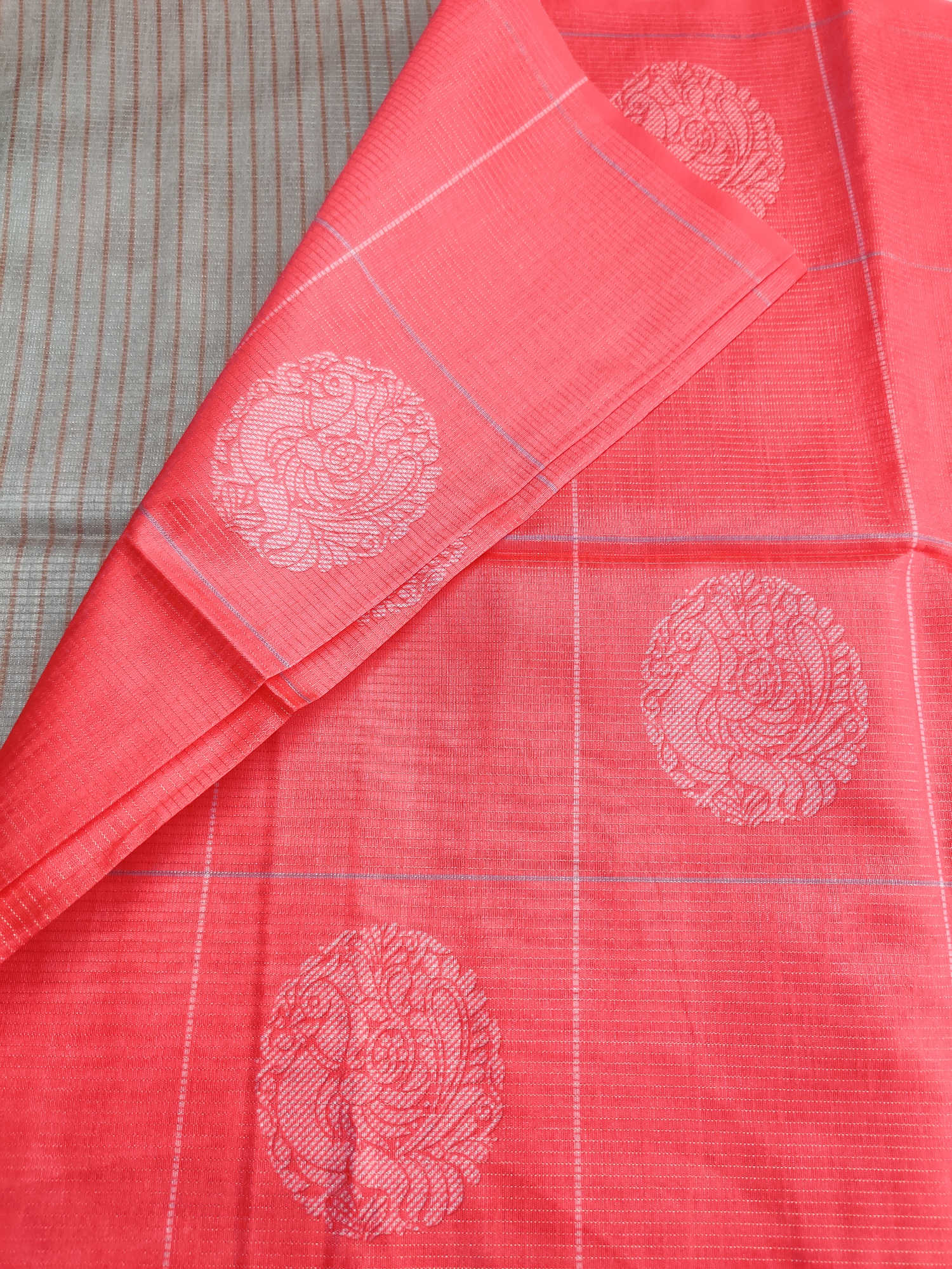 Bugara Semi Tussar Silk Saree – Coral Red Body with Silver Woven Butta & Elegant Beige Floral Pallu