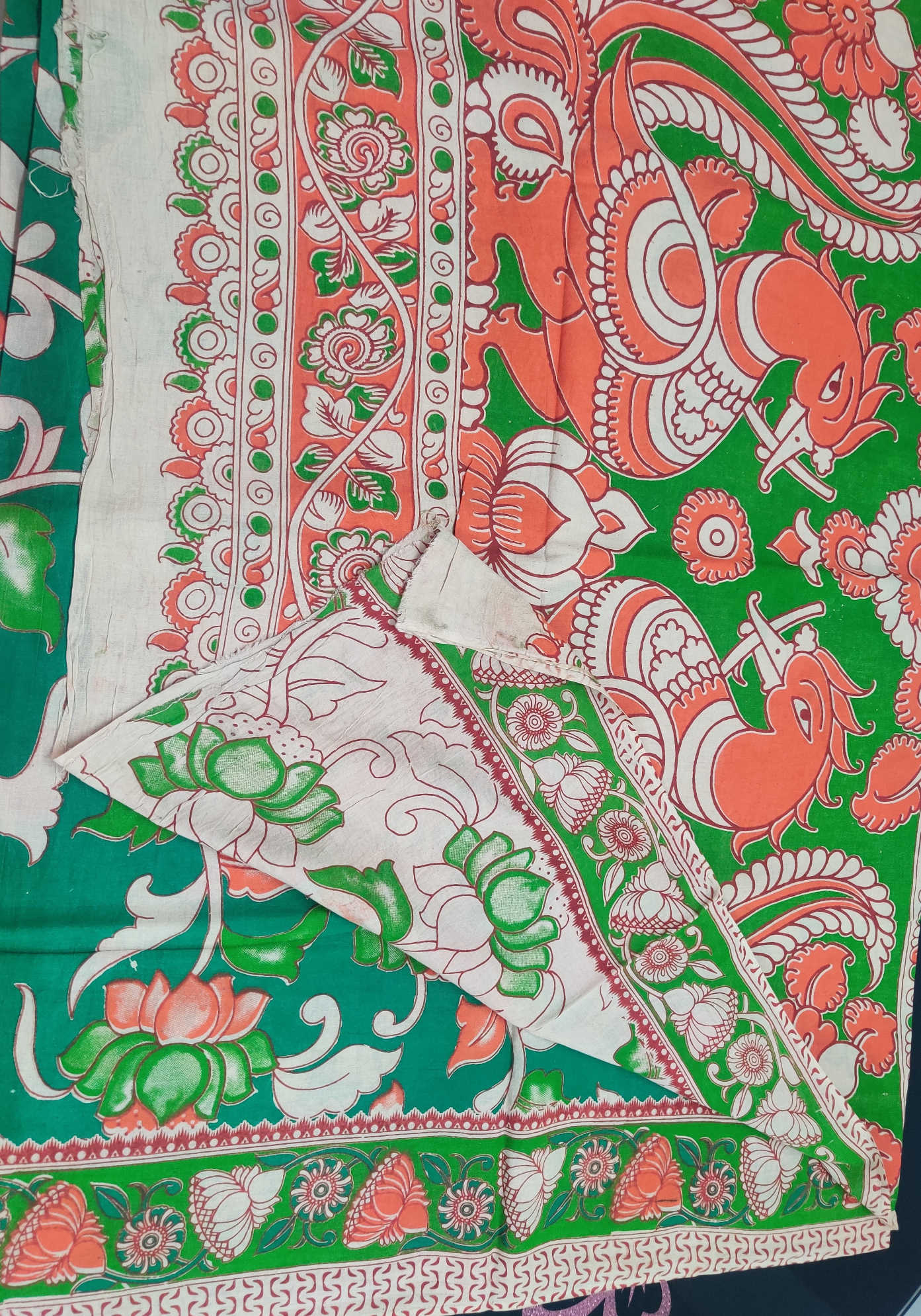 Kalamkari Cotton Saree – Green Body with Orange–White Floral Motifs & Traditional Kalamkari Bird Pallu