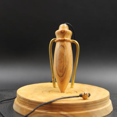 Pendule en bois d'olivier B84