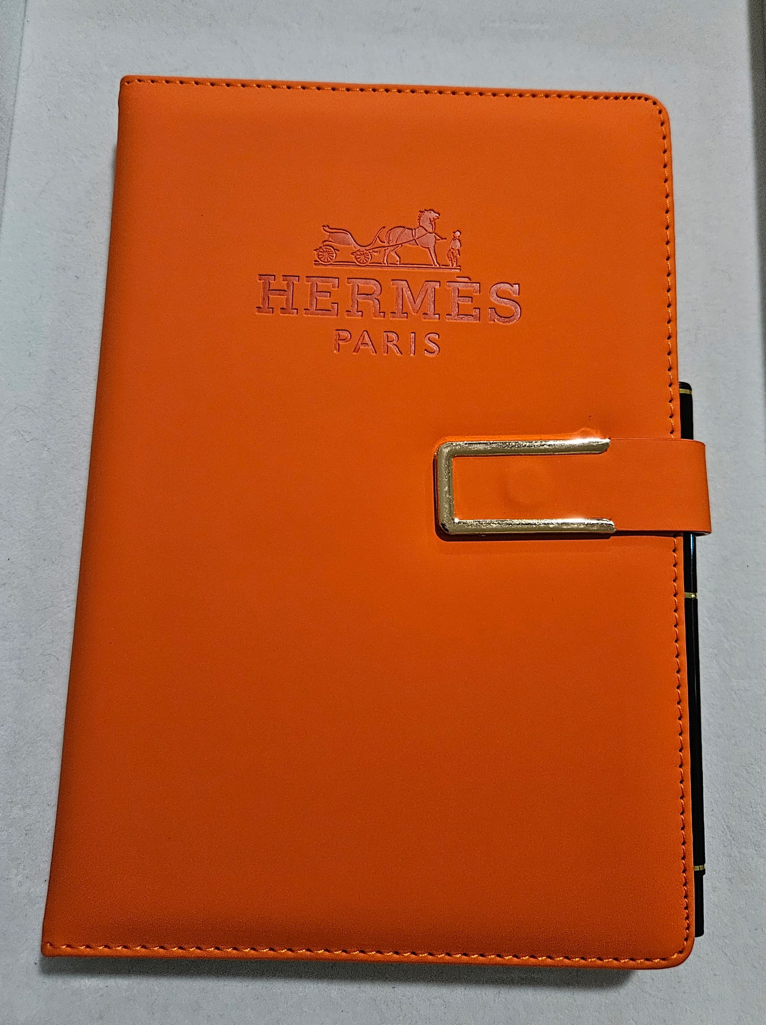 H Paris Orange Leather Notebook