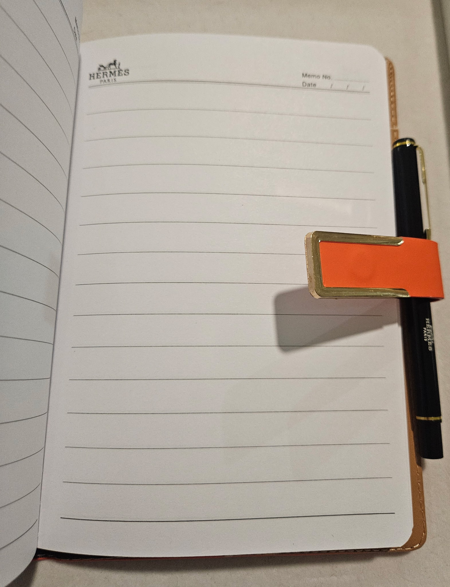 H Paris Orange Leather Notebook