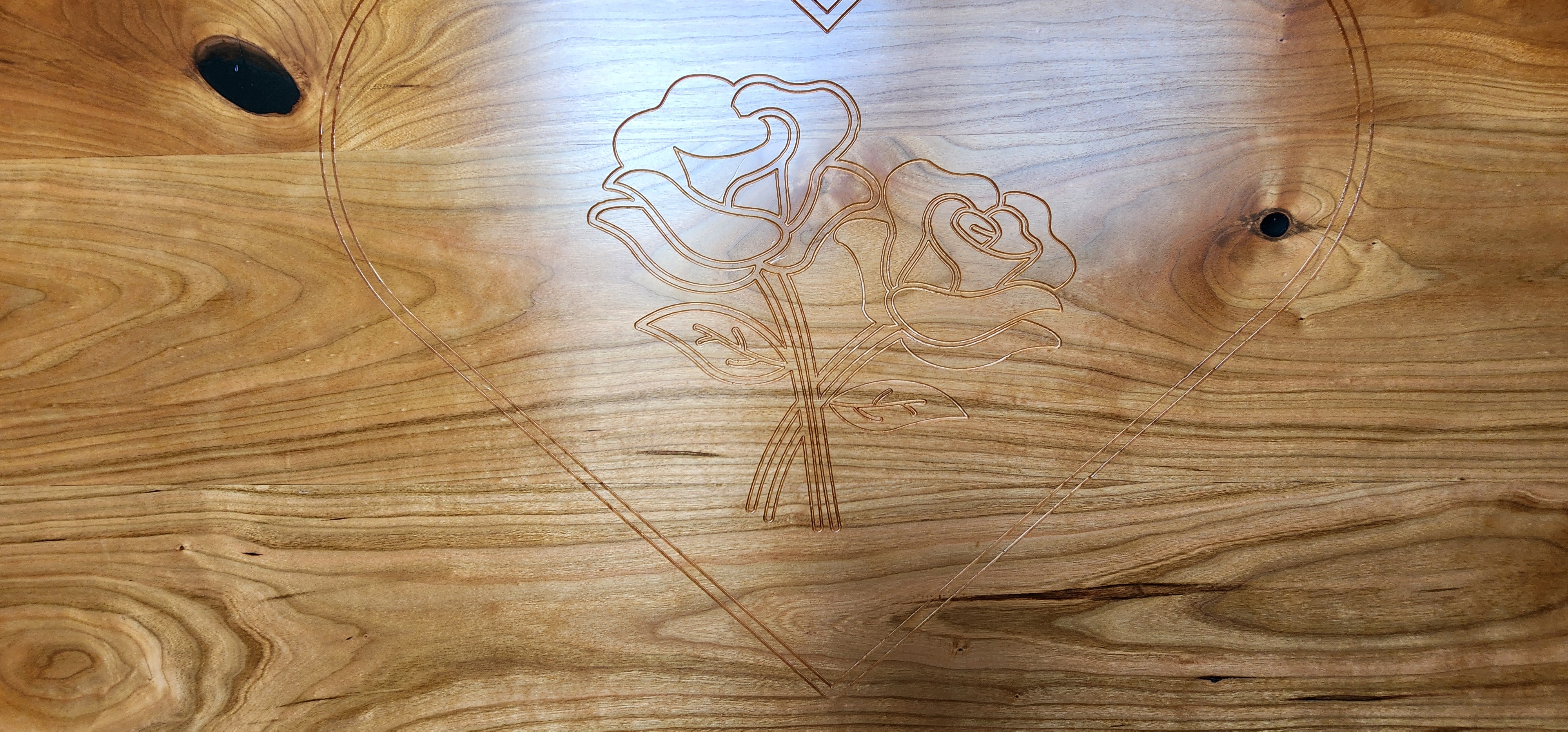 Engraved cherry hope chest with cedar lined bottom. dovetail corners and sitting rail on lid.