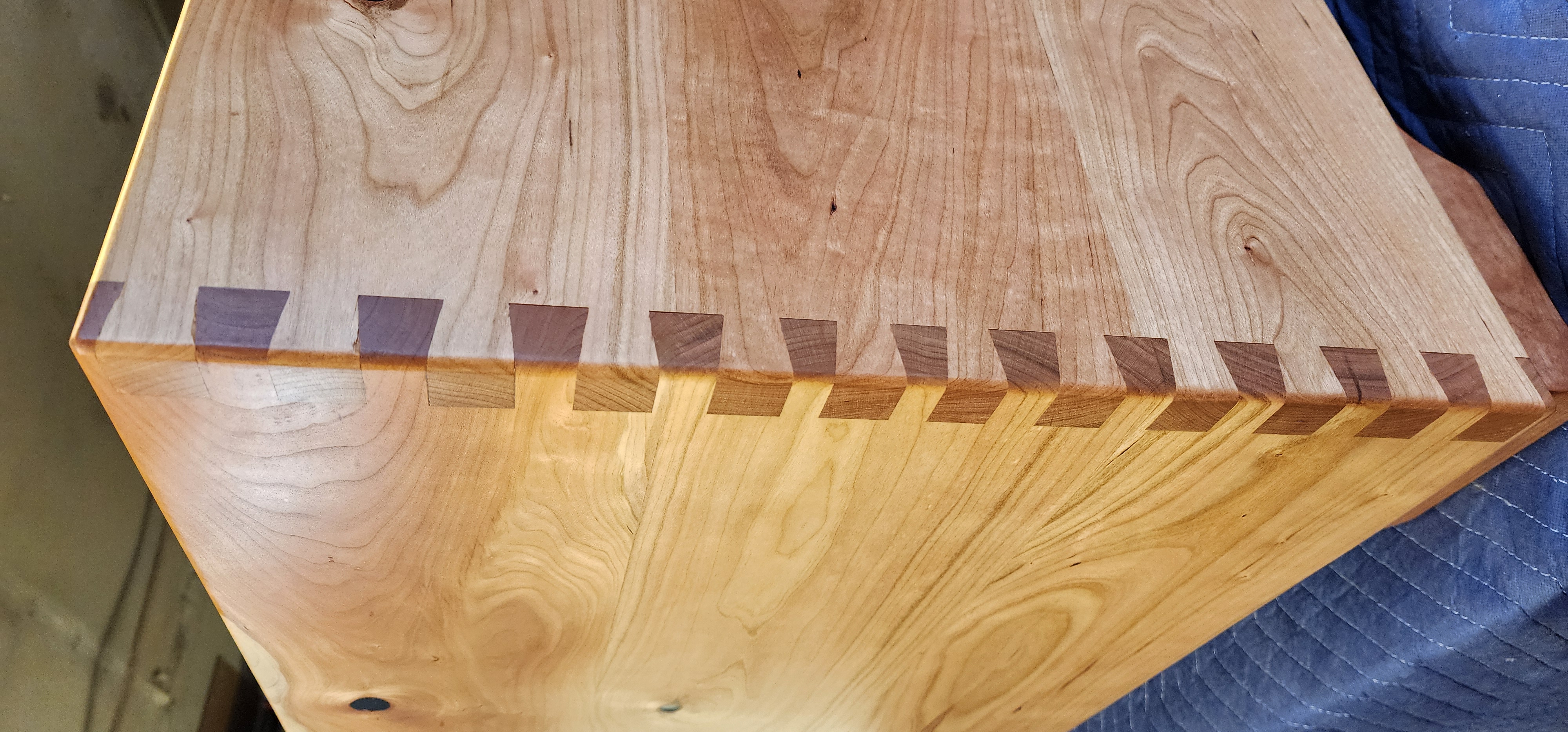 Engraved cherry hope chest with cedar lined bottom. dovetail corners and sitting rail on lid.