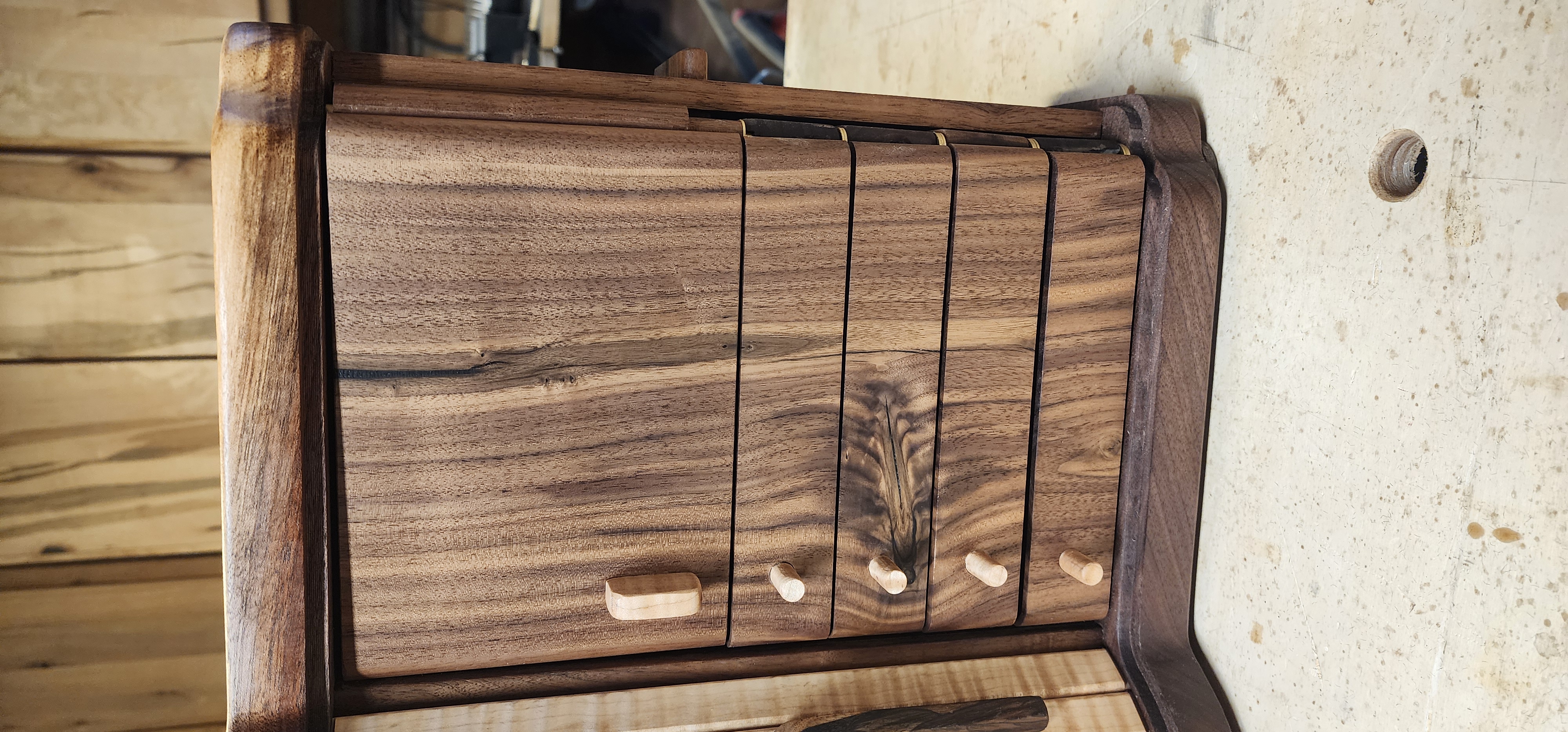 Walnut and maple jewlery box with tambour door, necklace ring and drawers 