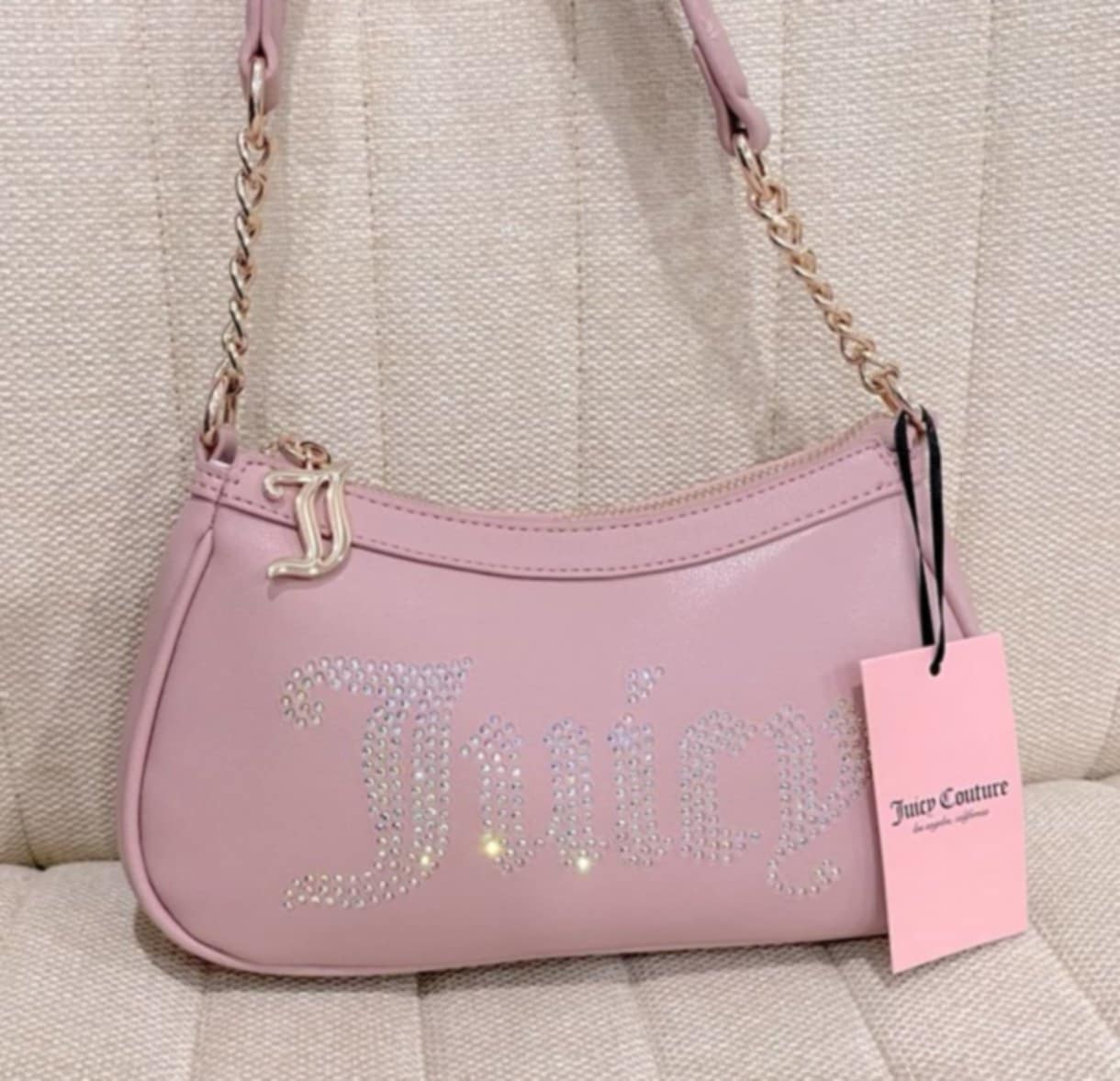 Bolso de hombro Juicy Couture en color rosa.