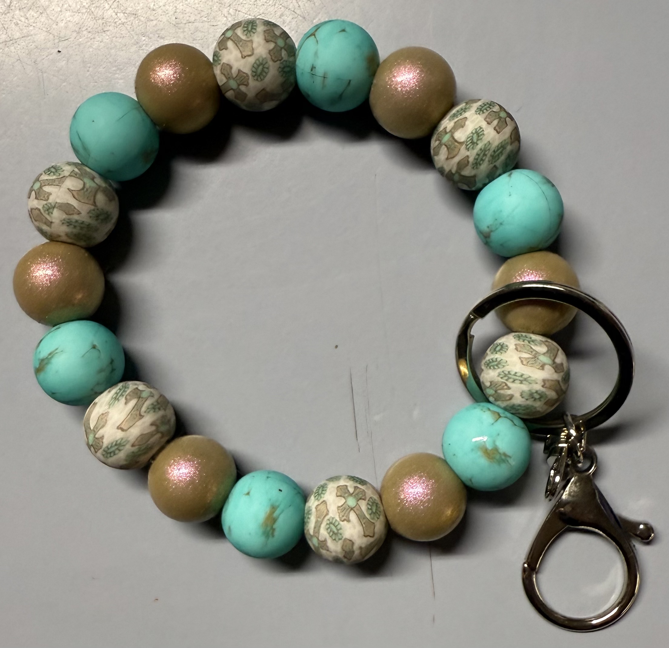 Cross and Teal Wristlet