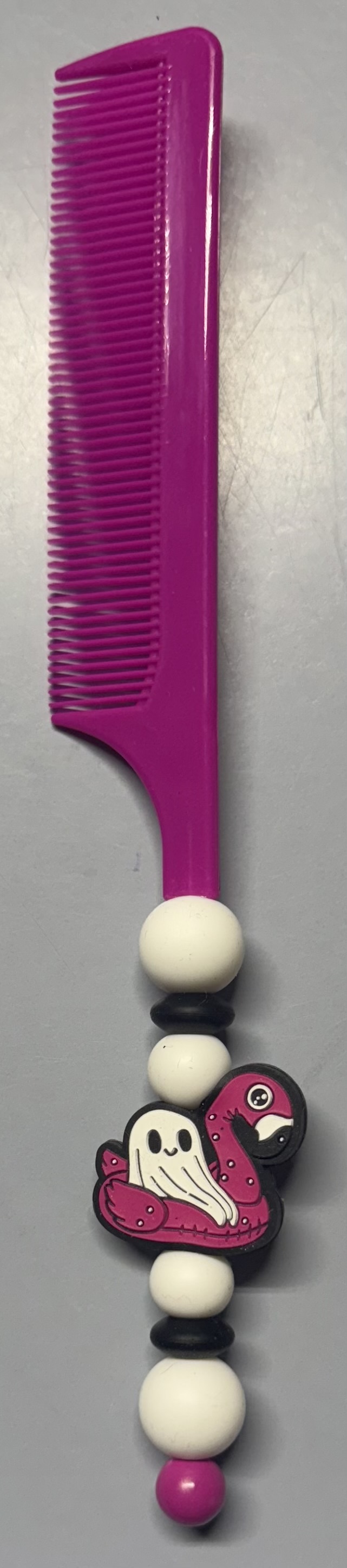 Pink comb with decorative flamingo