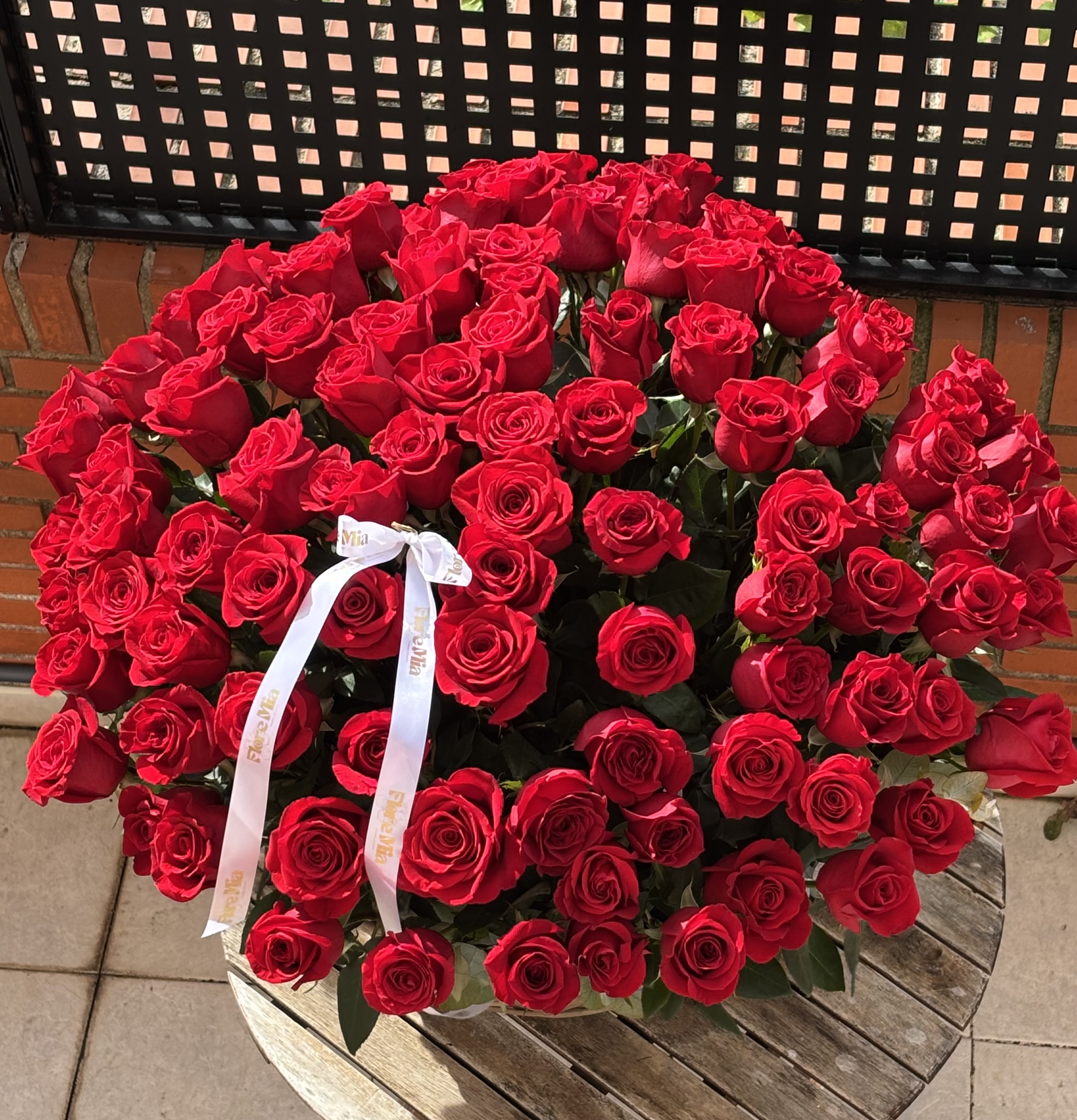 101 red roses in a basket