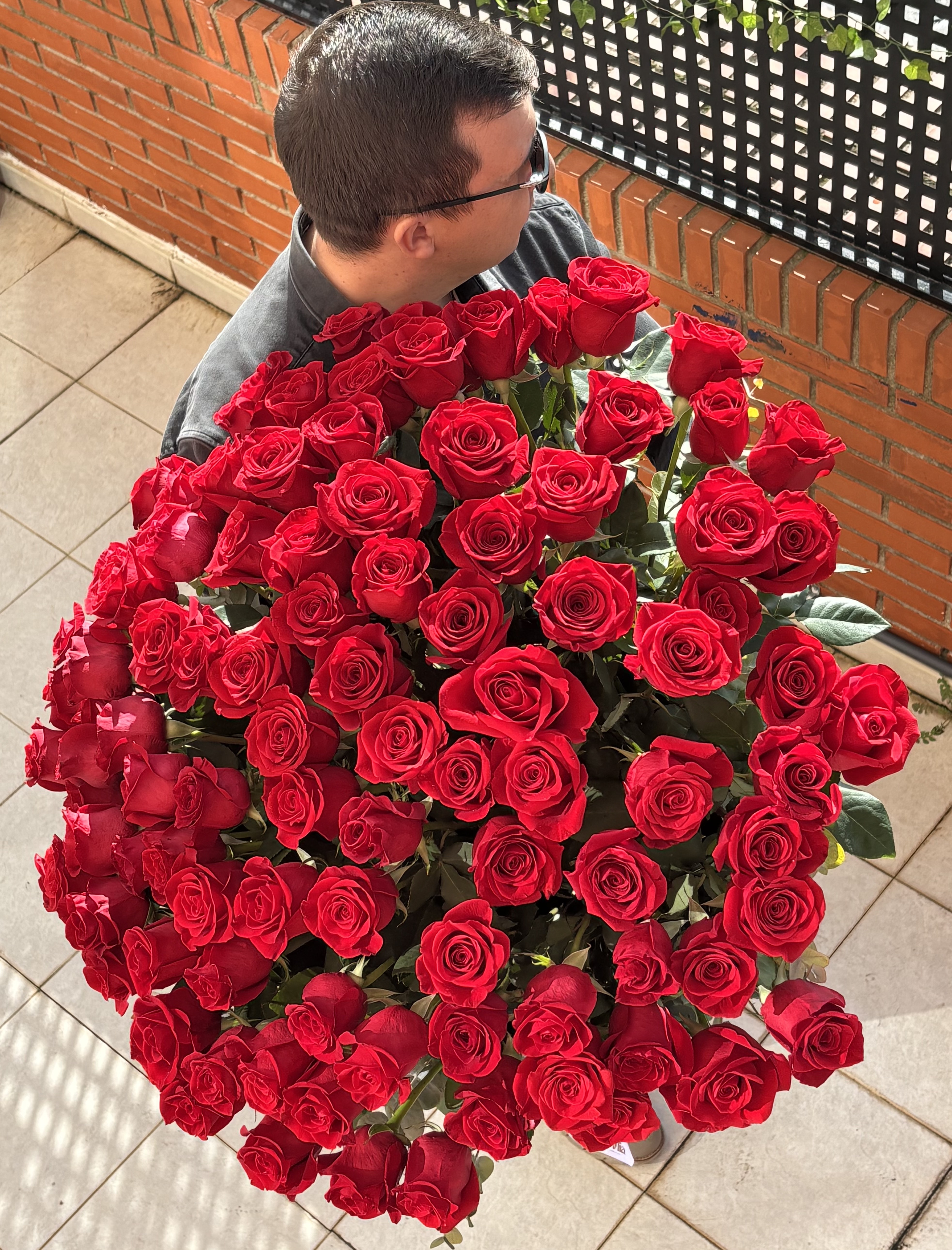 101 red roses in a basket