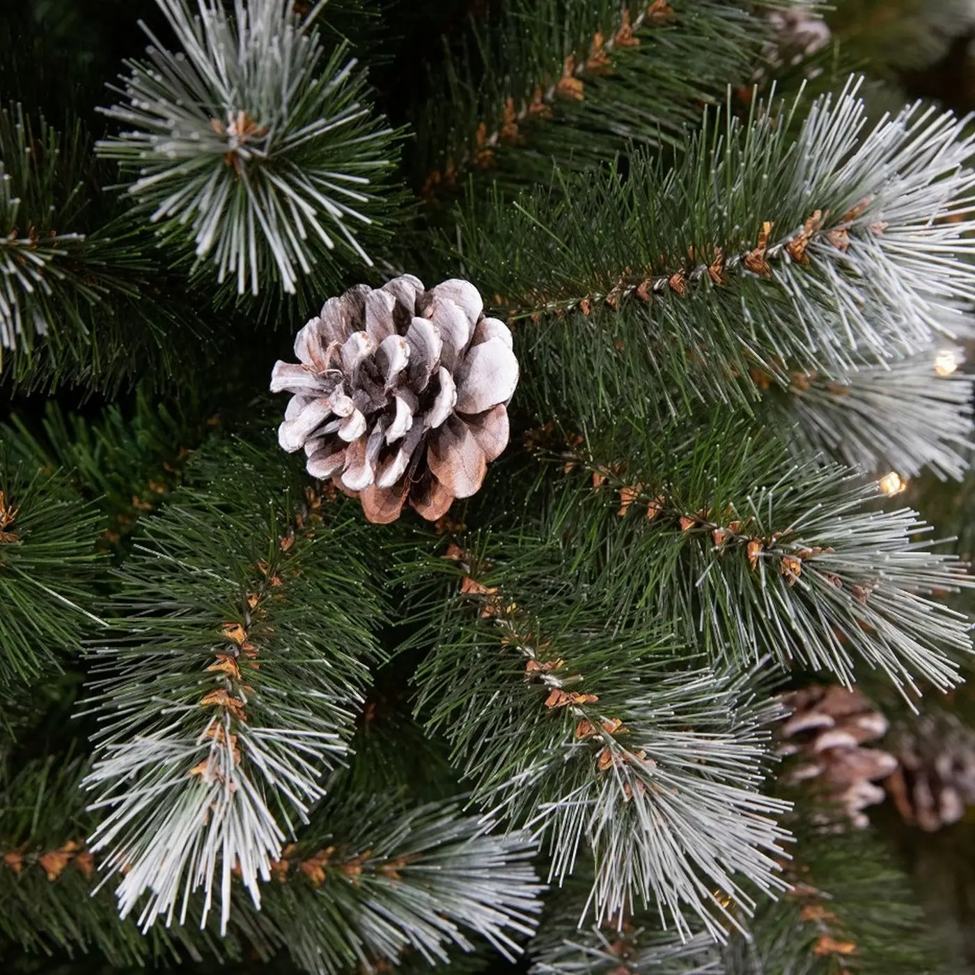 Artificial Christmas tree in frosted green with pine cones Pittsburgh