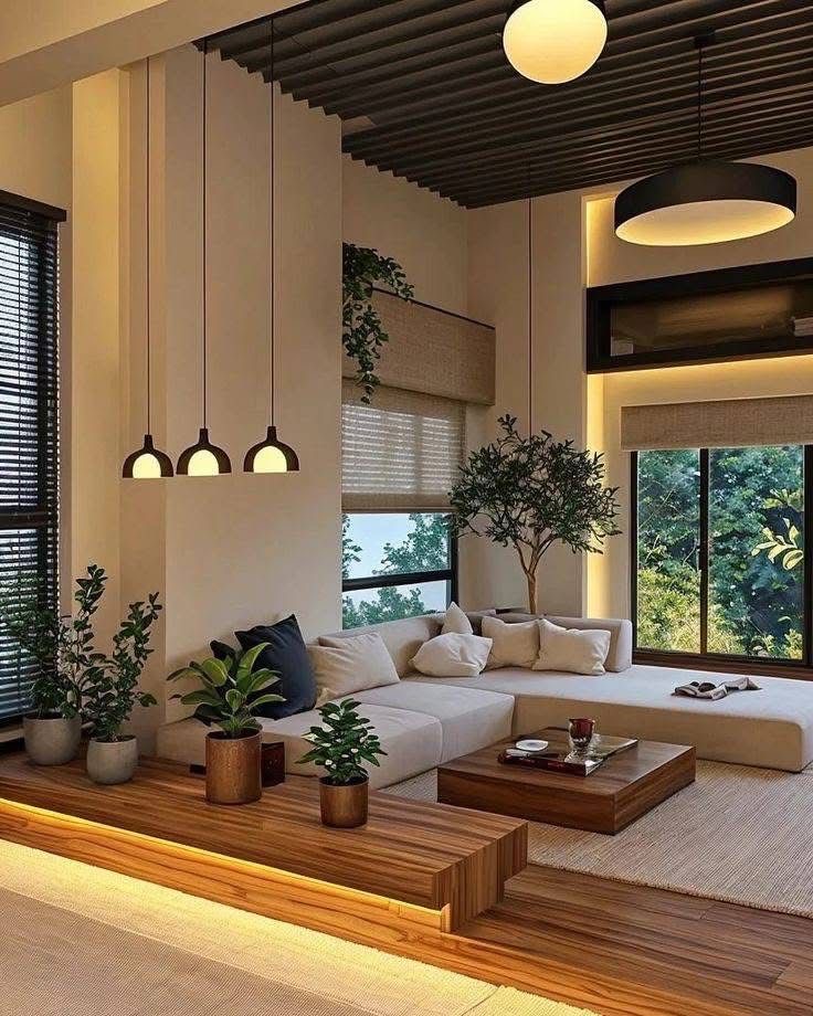 غرفة معيشة عصرية بإضاءة متقنة ولمسات طبيعية