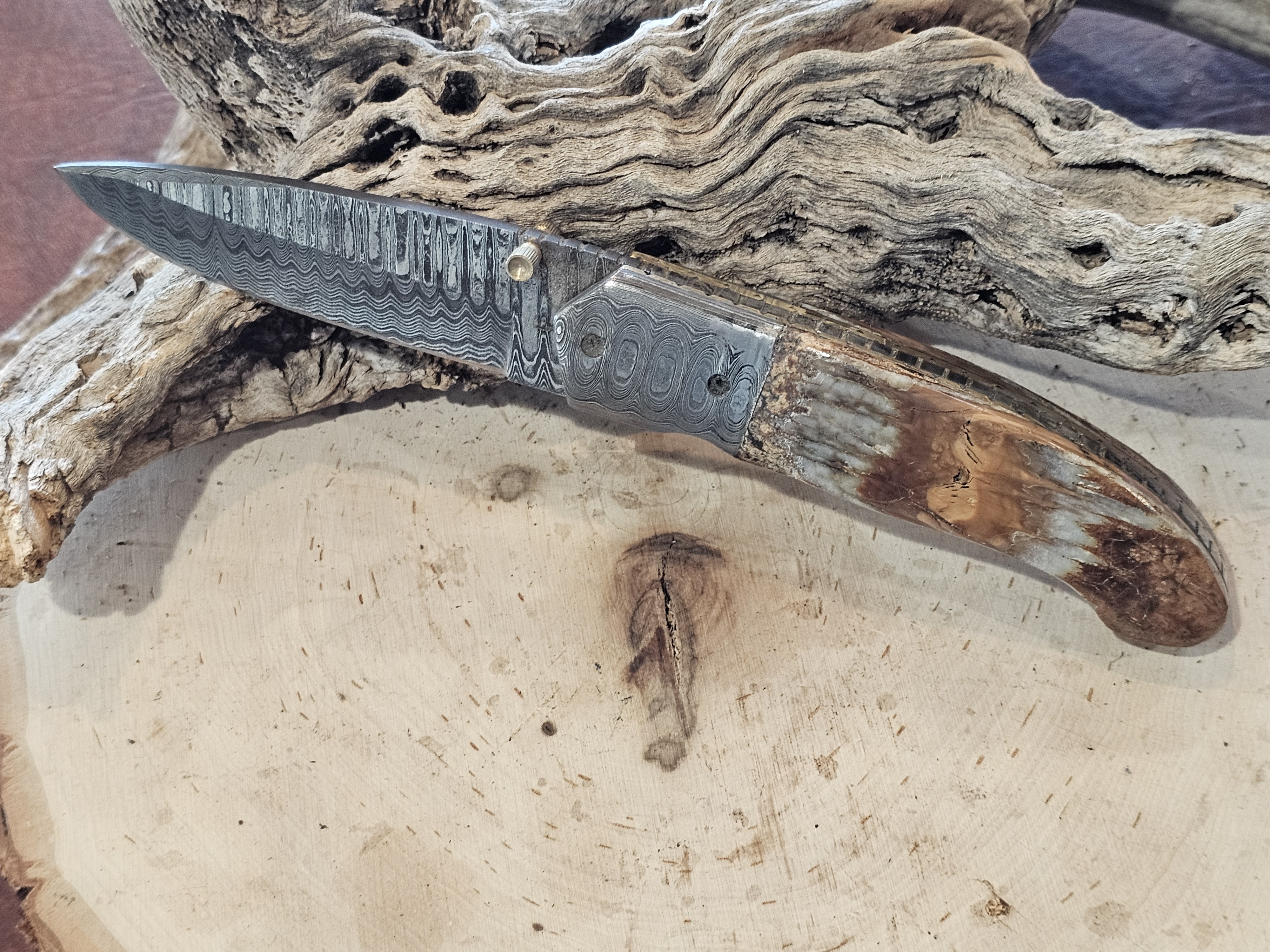 Handcrafted Damascus Steel Folding Knife with Mammoth Tooth Handle