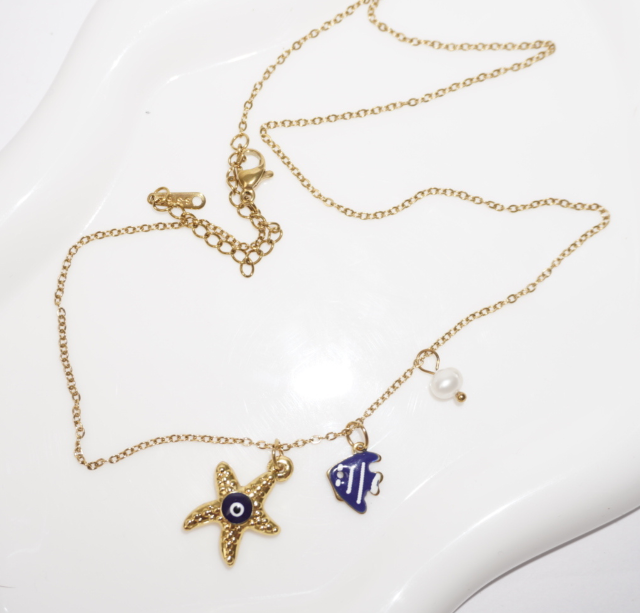 Collar estrella marina,  ojo y pez azul