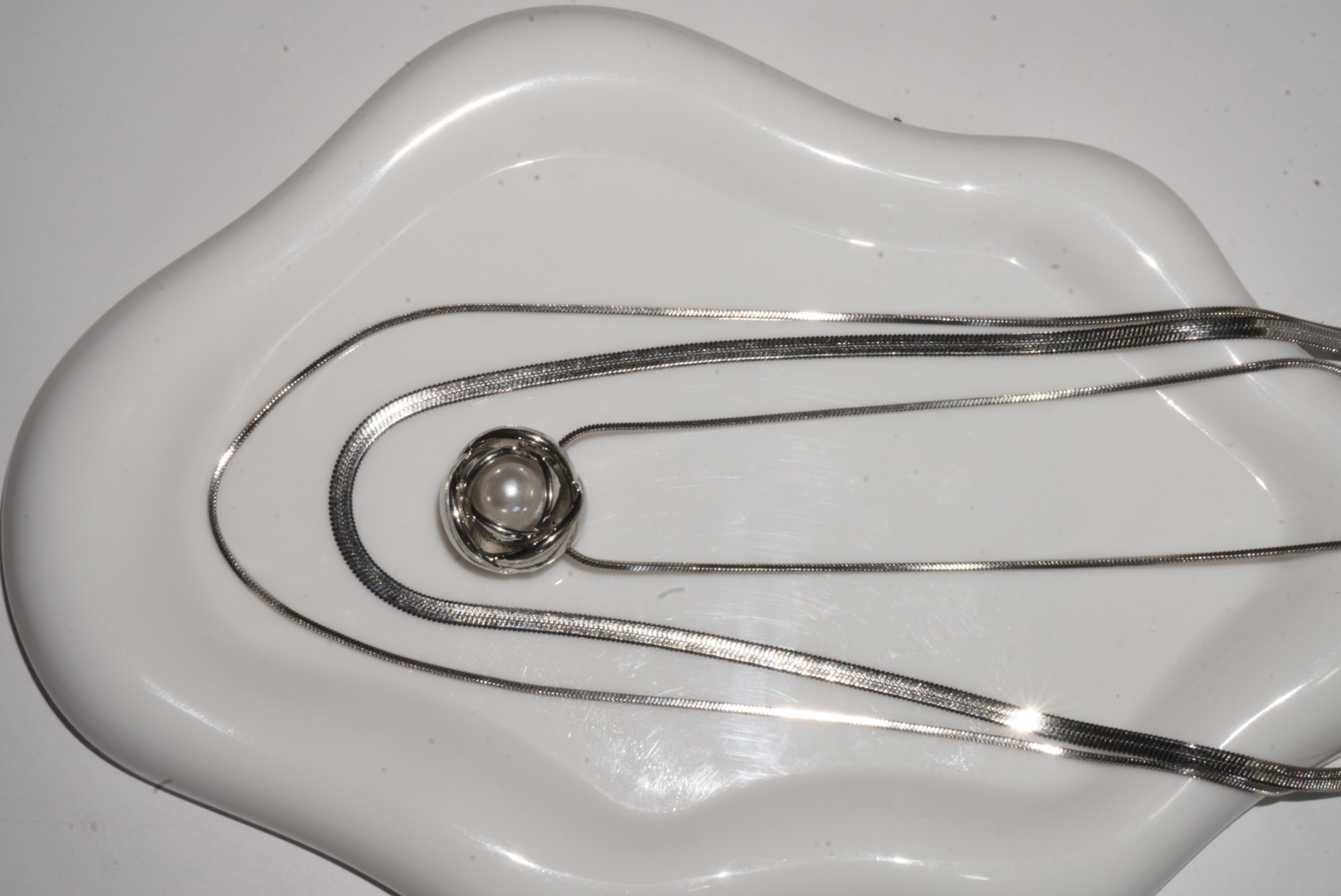 Collar flor con perla plateado