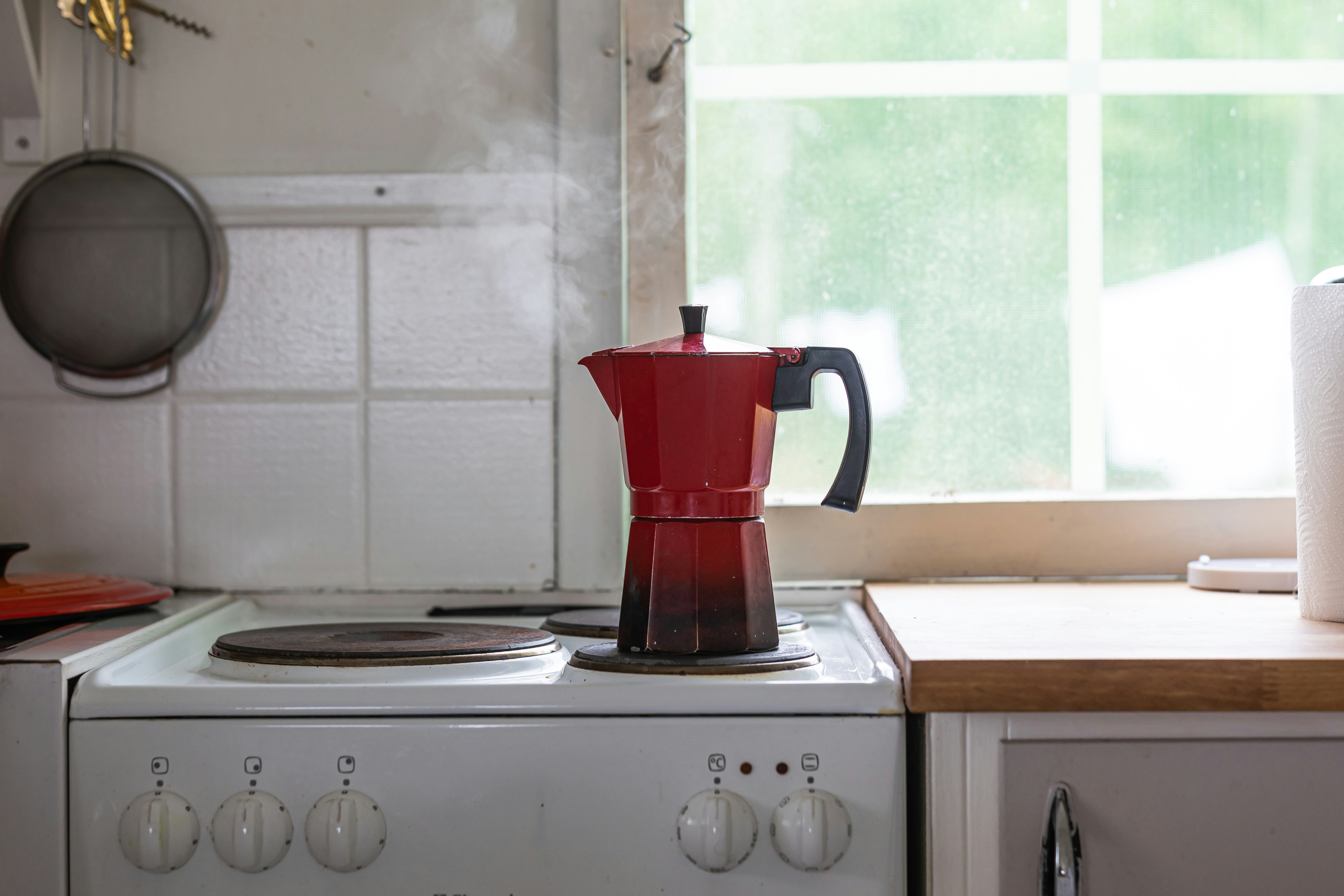 Red stovetop espresso maker