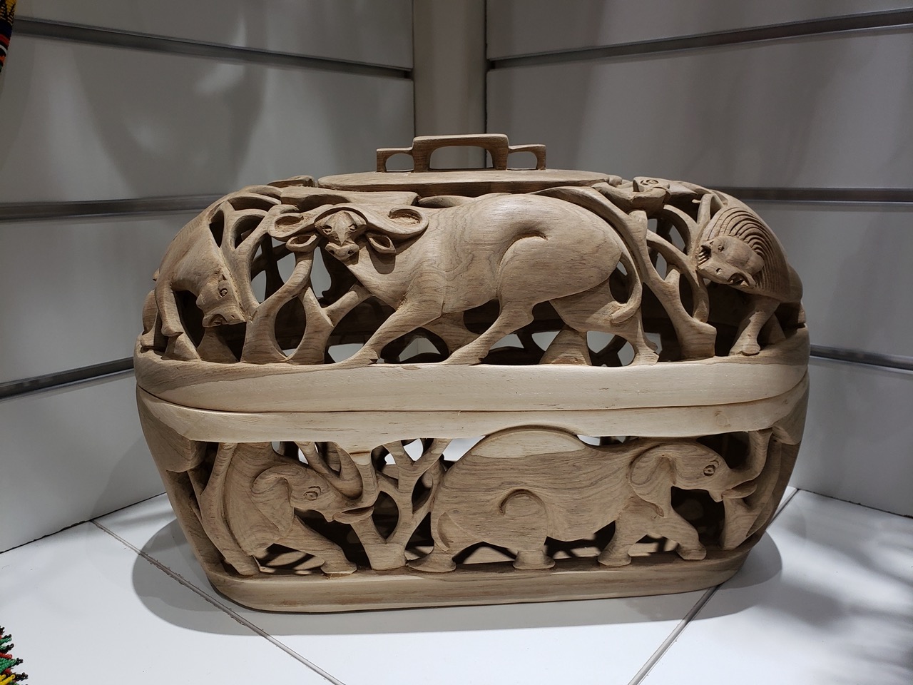 Hand-carved wooden animal motif basket