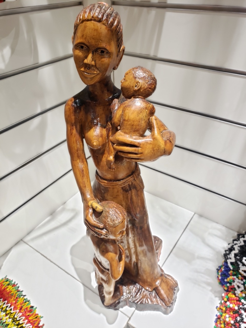 Handcrafted Wooden Mother and Children Sculpture