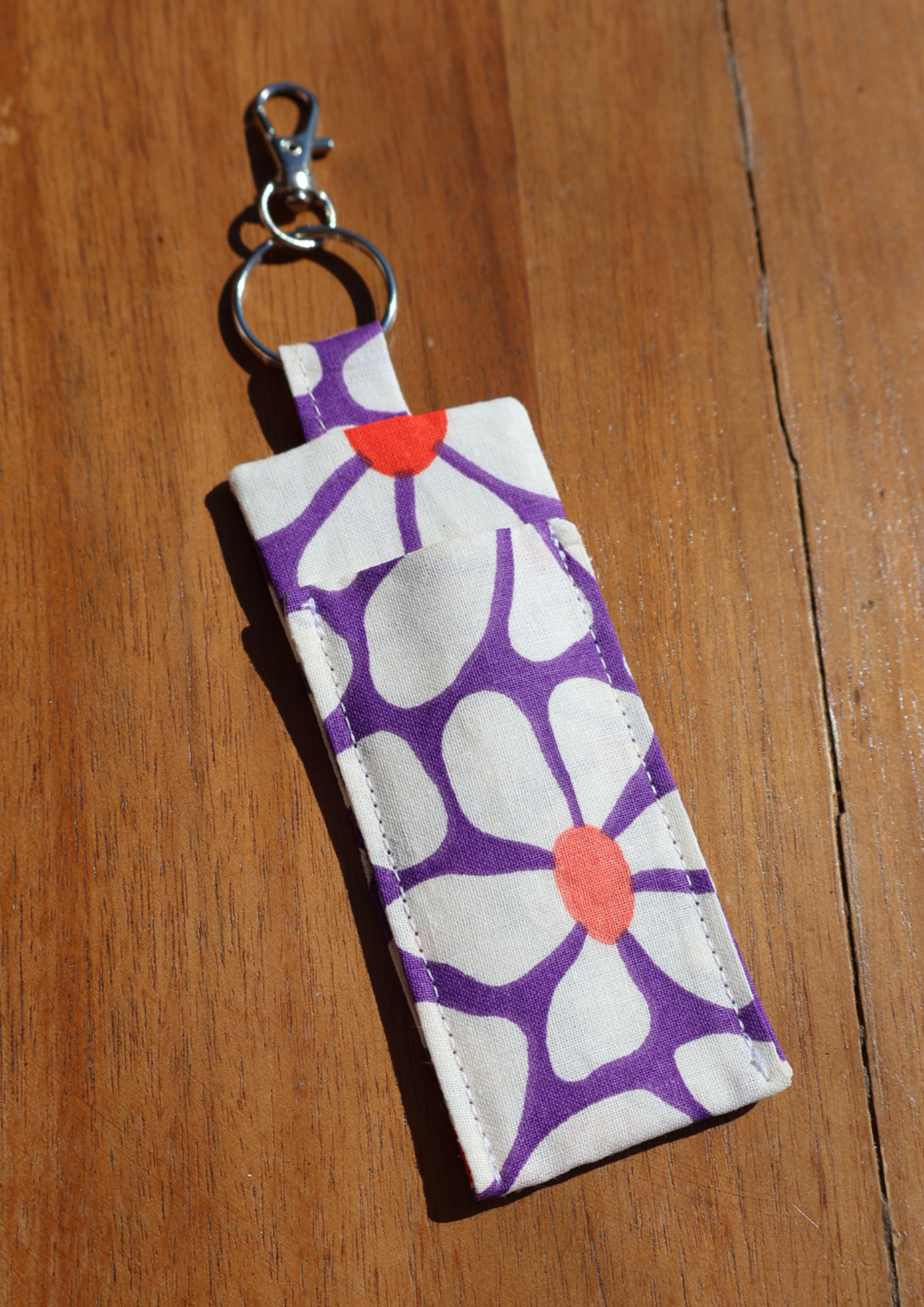 La pochette gloss porte-clés (fleurs)