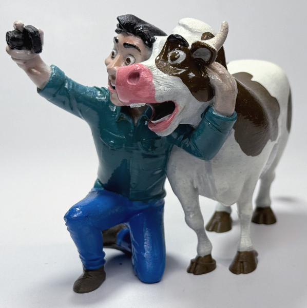 تمثال شخص وبقرة فكاهية