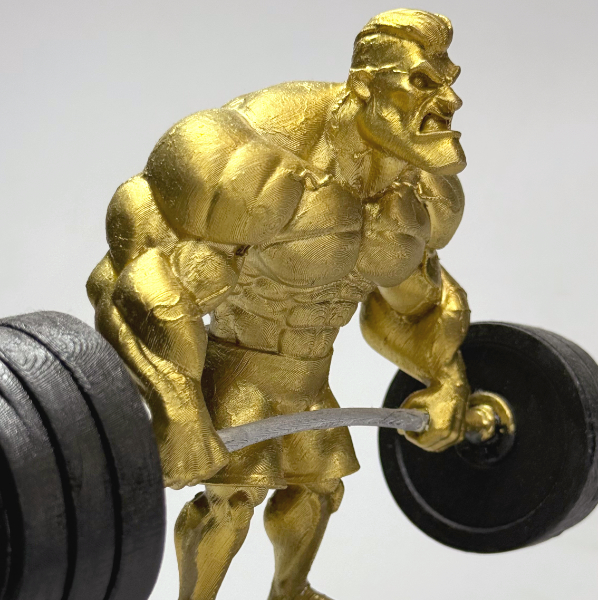 تمثال رفع الأثقال الذهبي