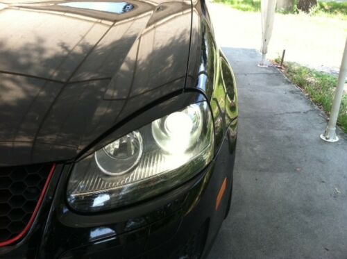 Priekinių žibintų uždengimai (komplektas) VOLKSWAGEN GOLF-5 (2003-2008)