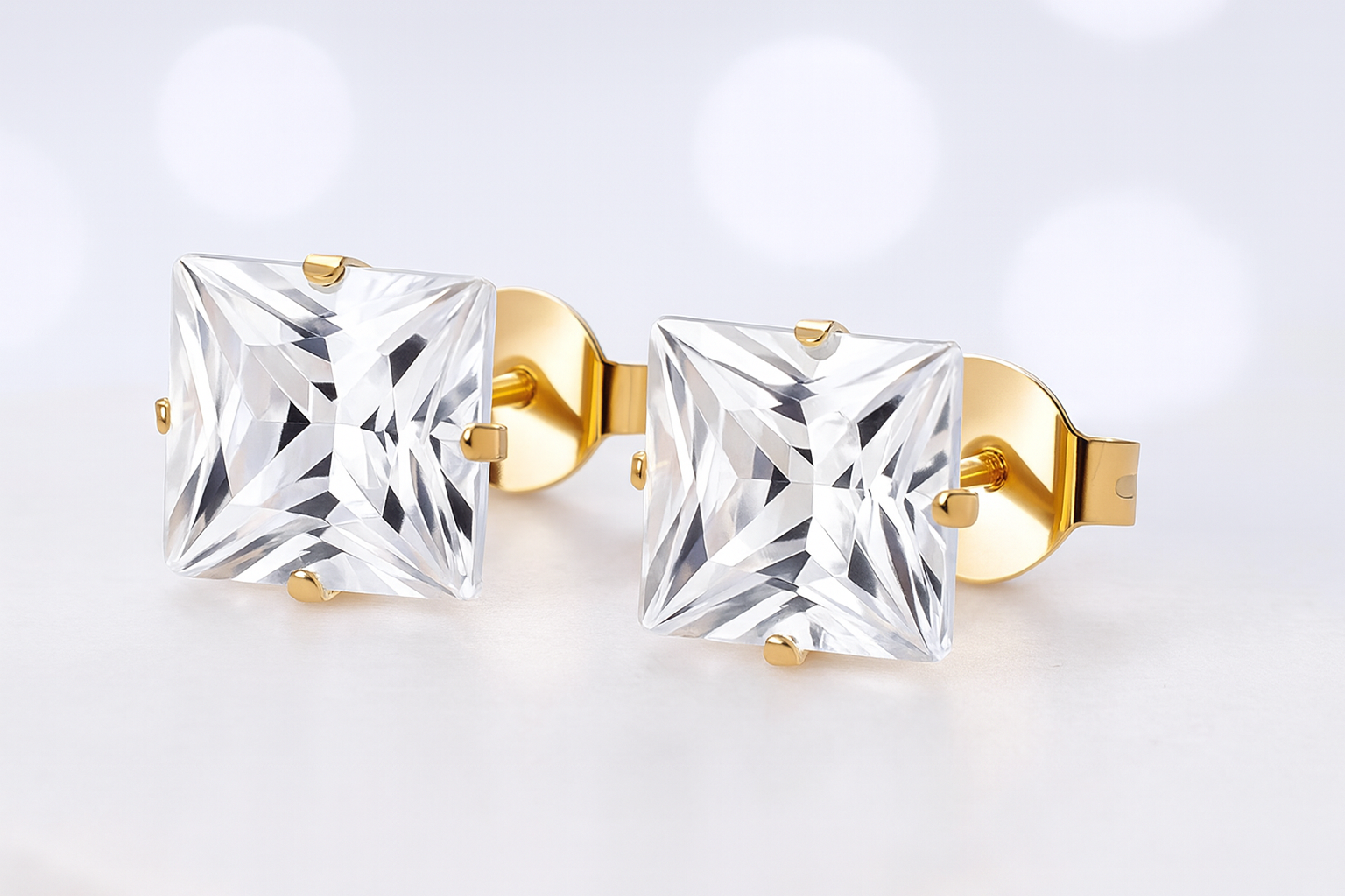 Boucles d’oreilles en or et zircon carré