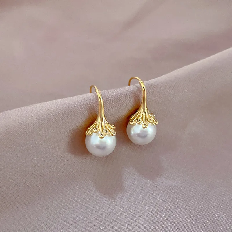 Boucles d’oreilles dorées perle unique