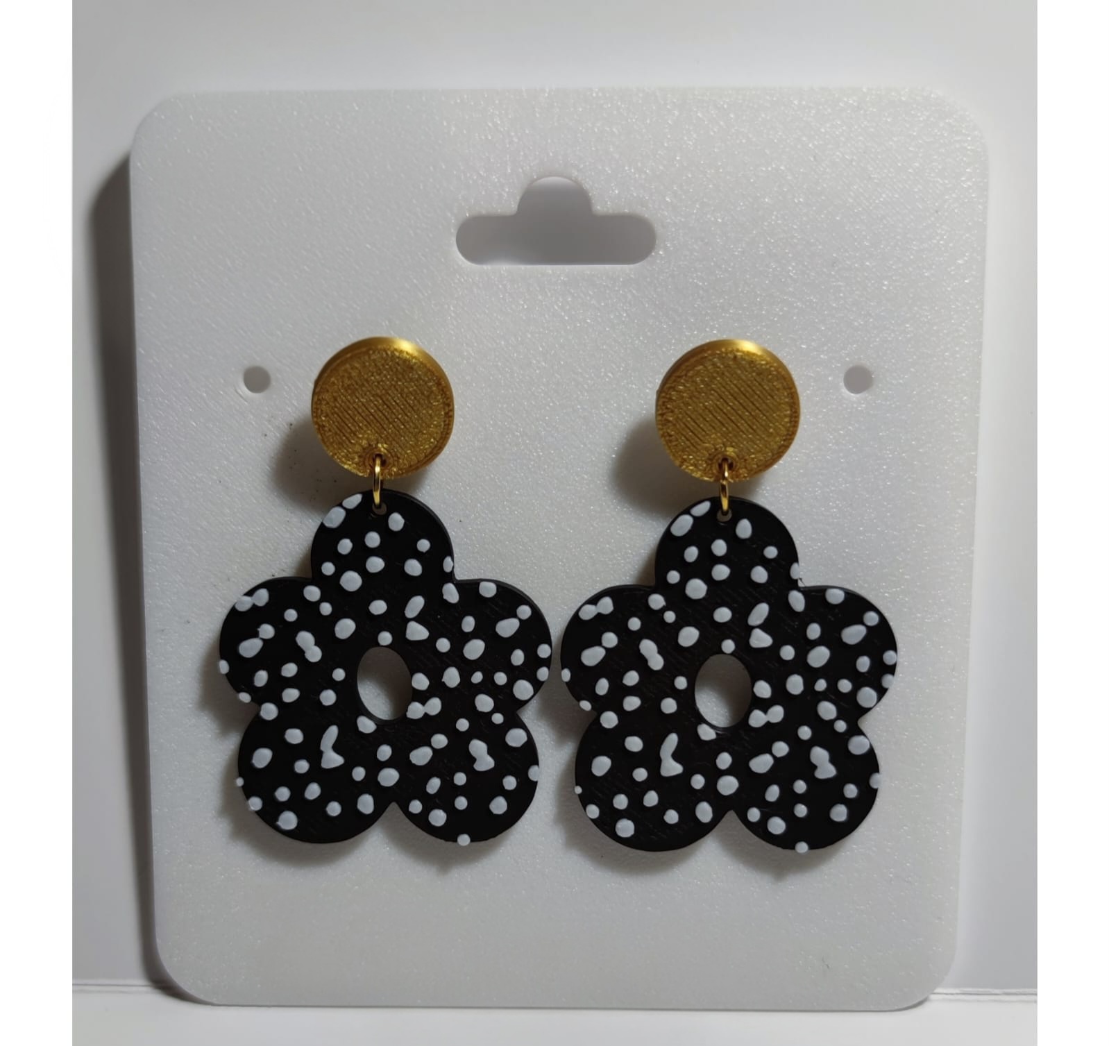 Pendientes de estrellas con lunares blancos