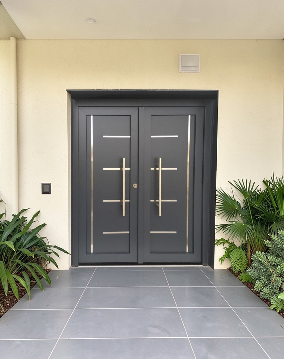 Puerta Premium 604 – Puerta doble moderna con detalles en acero inoxidable