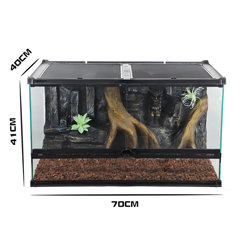 Glass reptile terrarium with simulated landscape