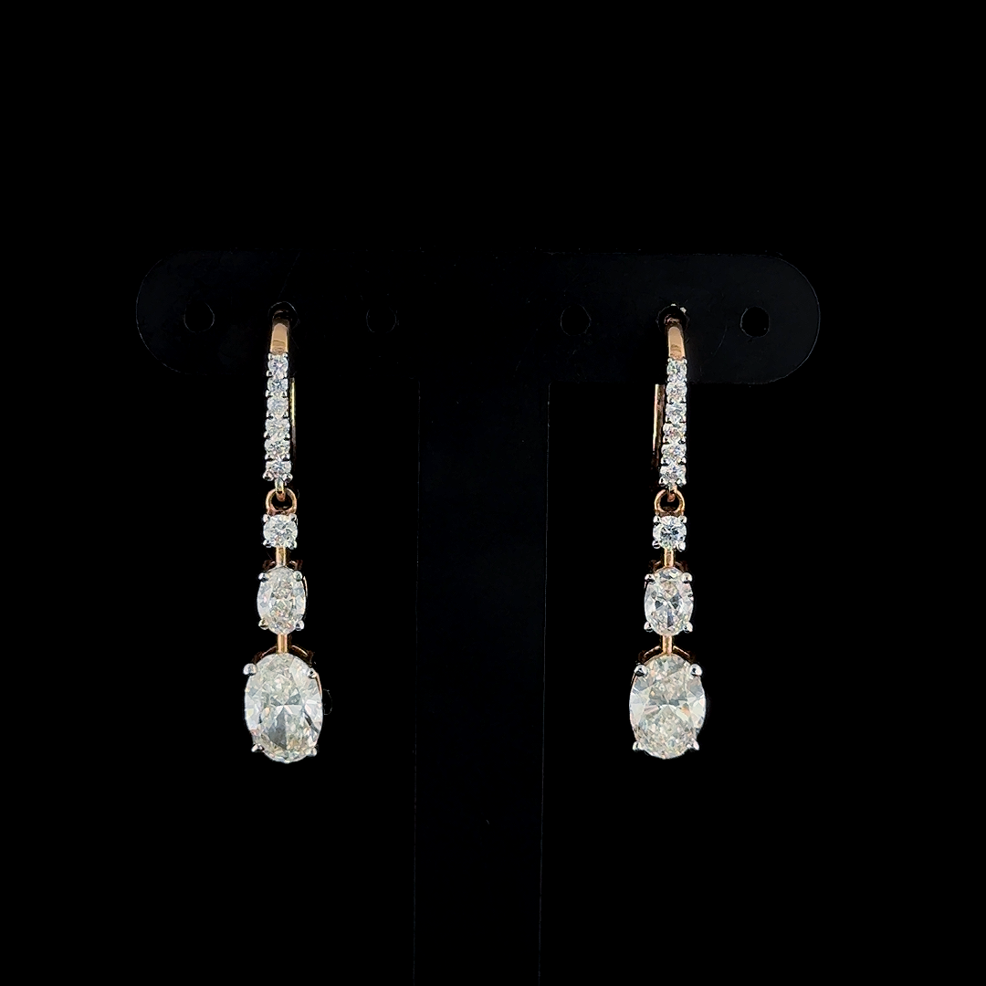 Elegant Diamond Drop Earrings in Gold and CVD