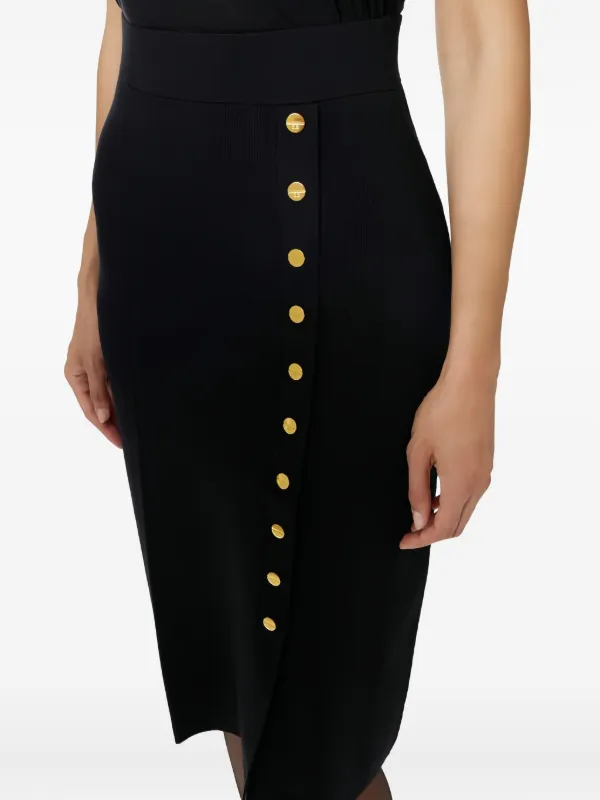 تنورة ميدي سوداء بأزرار ذهبية جانبية