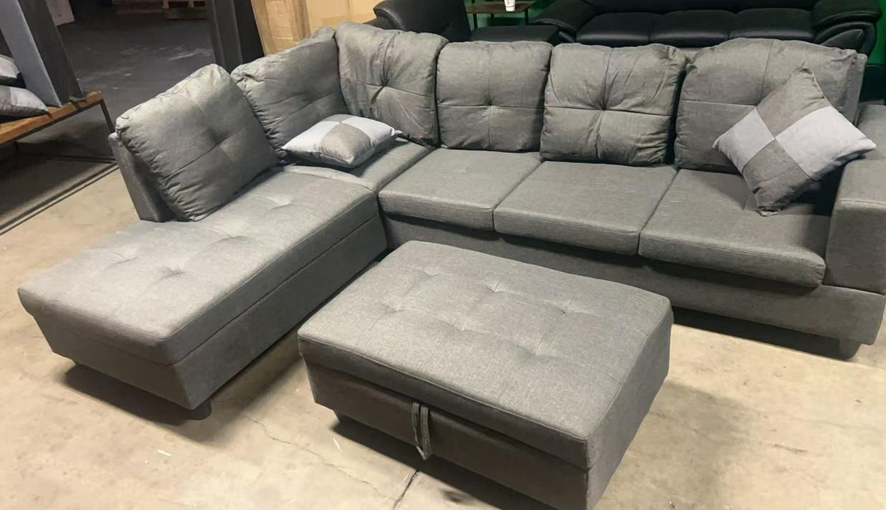 Dark grey sectional with ottoman included