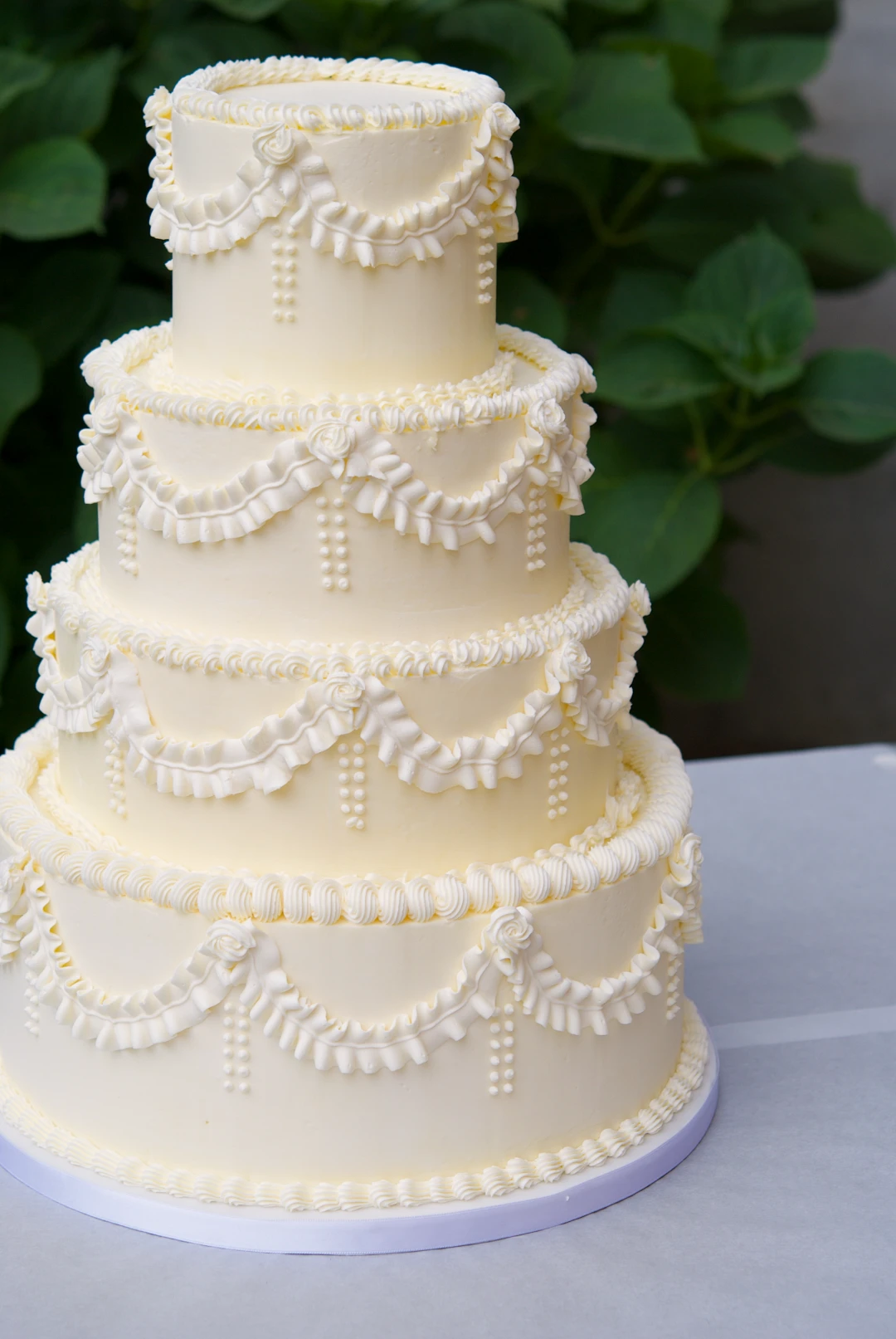 Pastel de boda de cuatro pisos