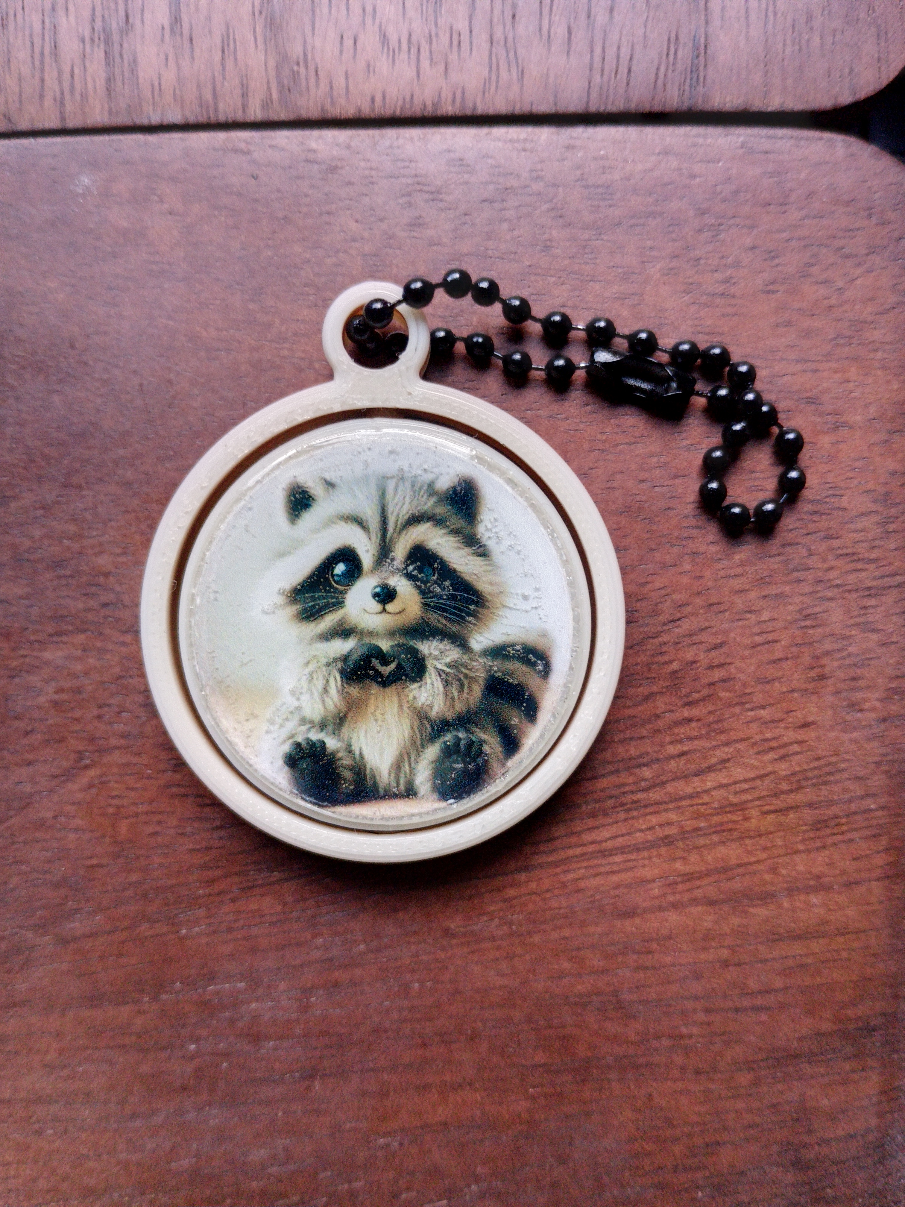 Porte-clés gyroscopique raton laveur