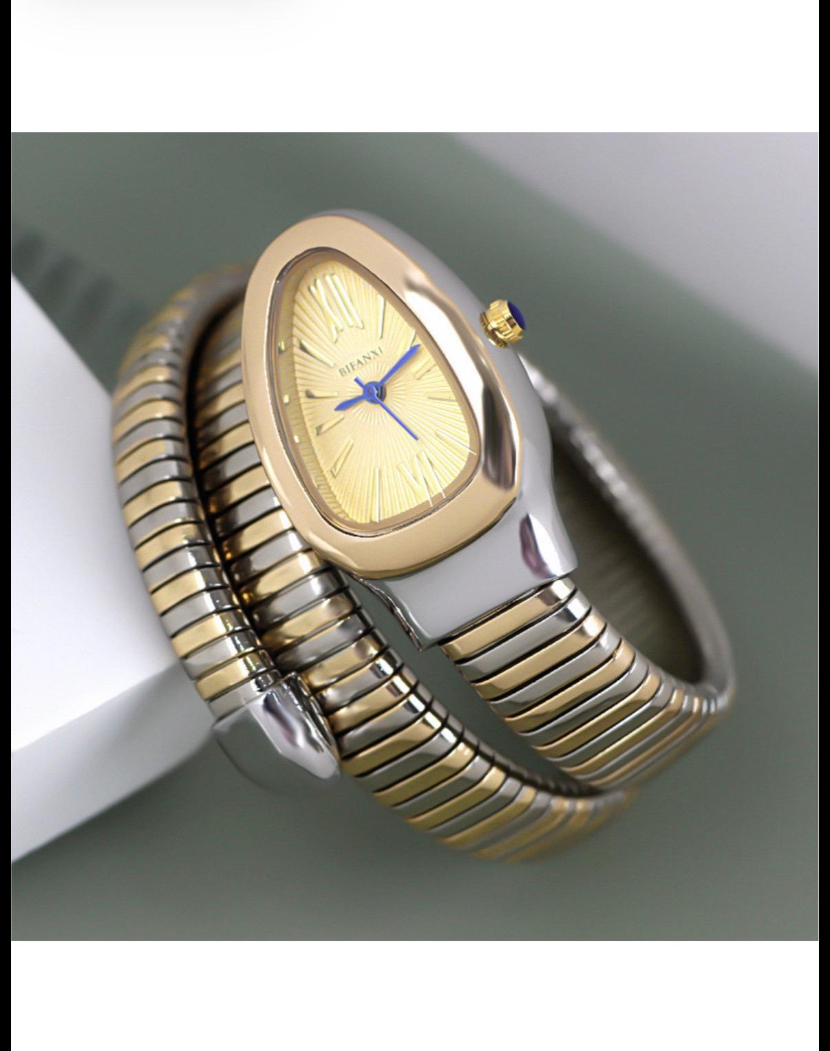 Montre serpent dorée