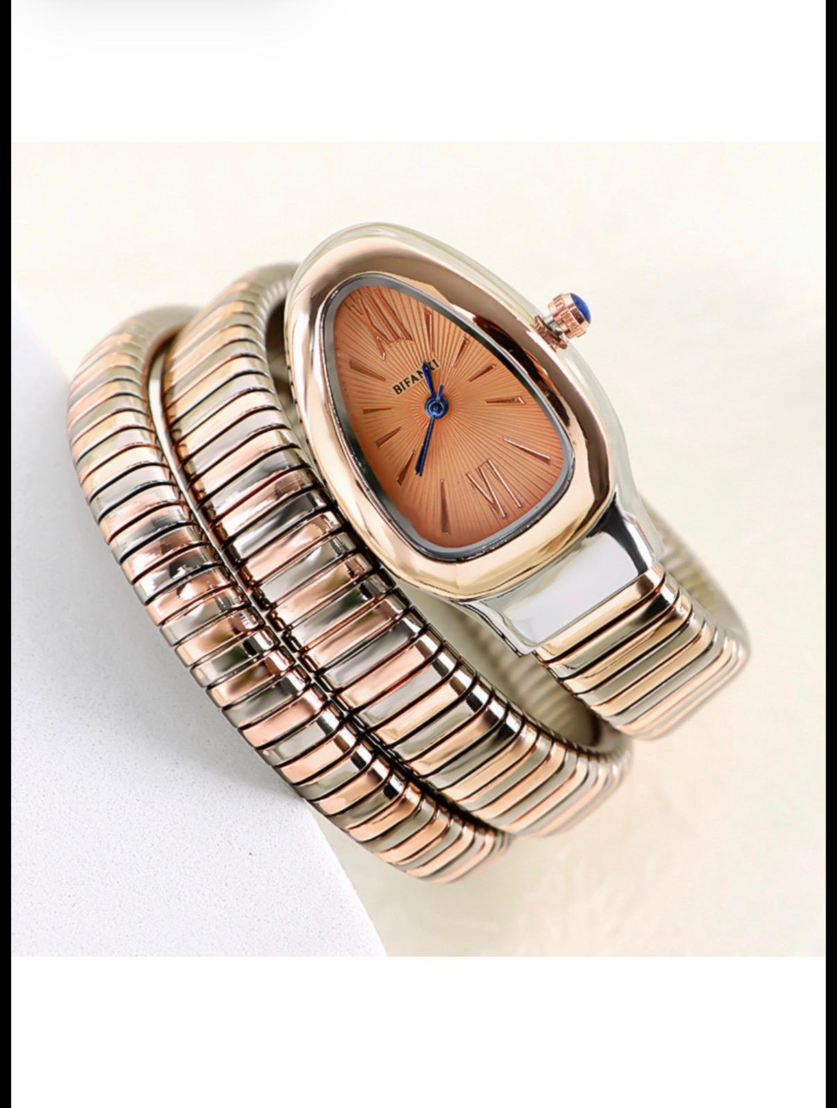 Montre serpent dorée