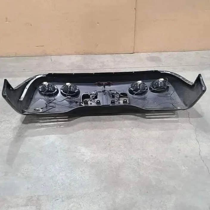 Rear bumper with light mounts