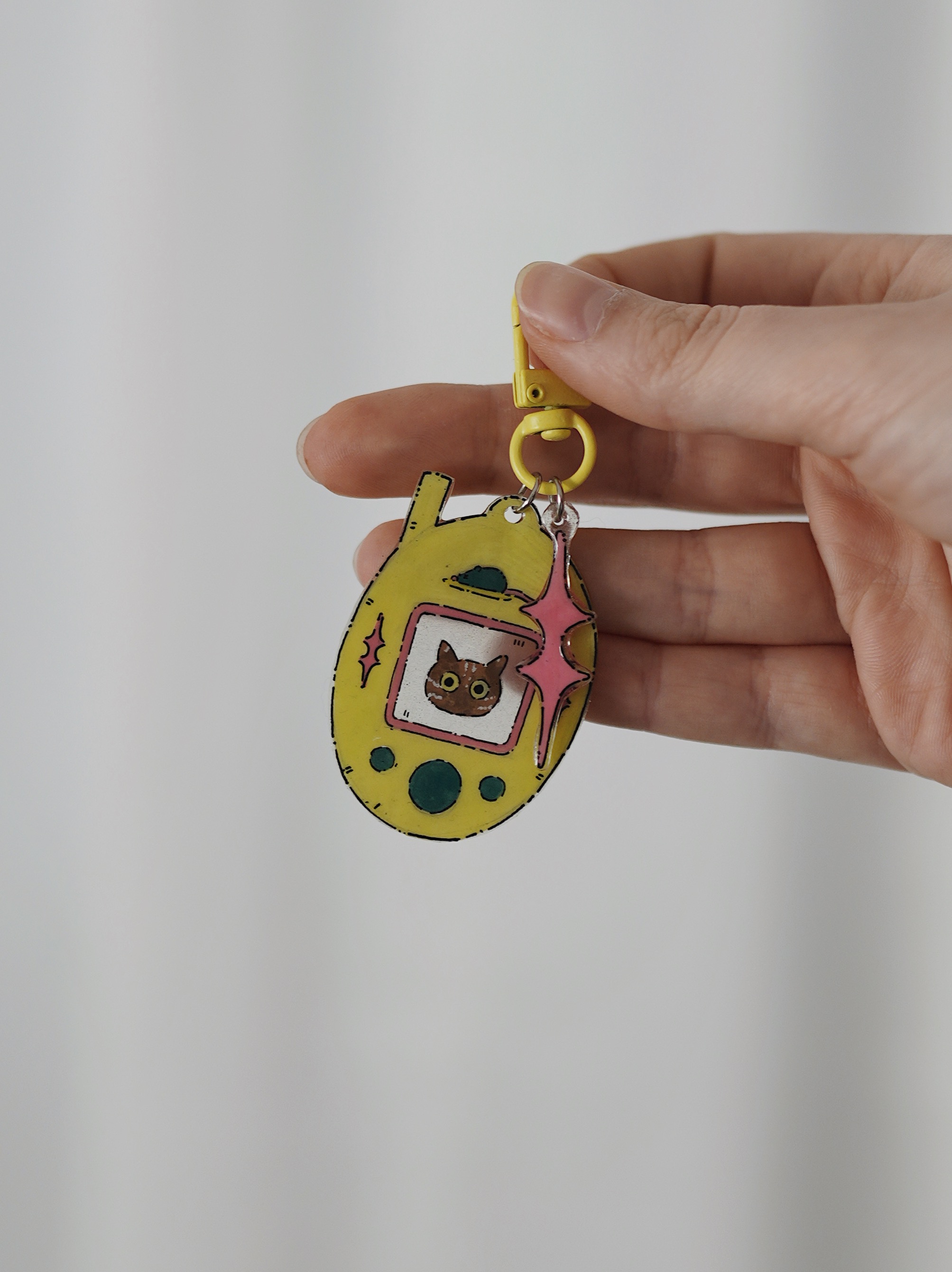 Raktų pakabukas su Tamagotchi rudu kačiuku