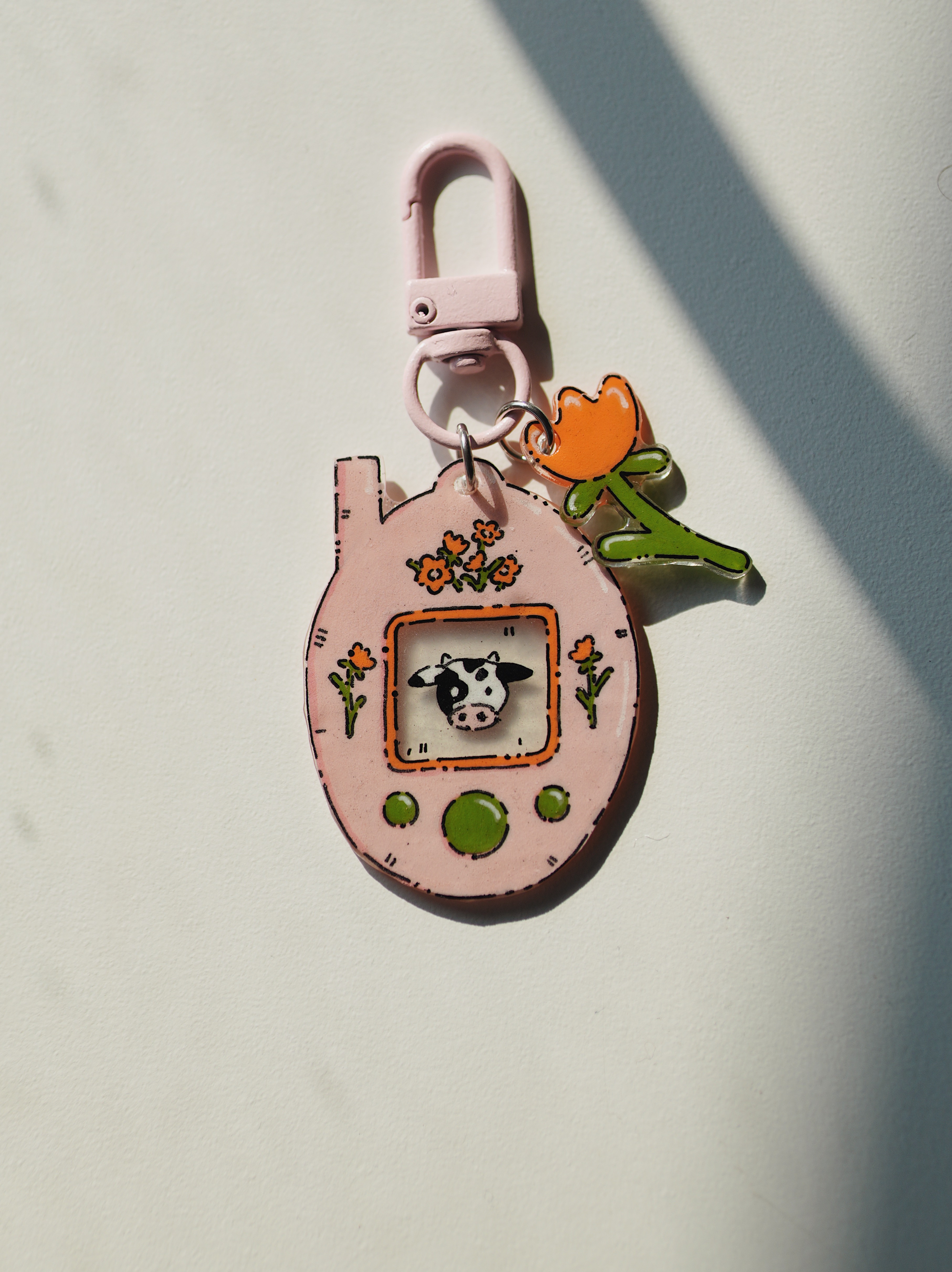 Raktų pakabukas su Tamagotchi karvute