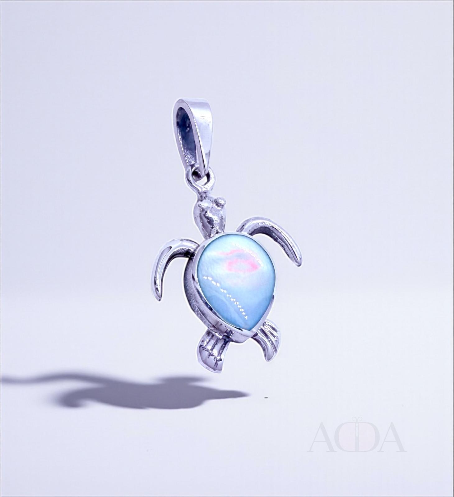 Dije tortuga de plata