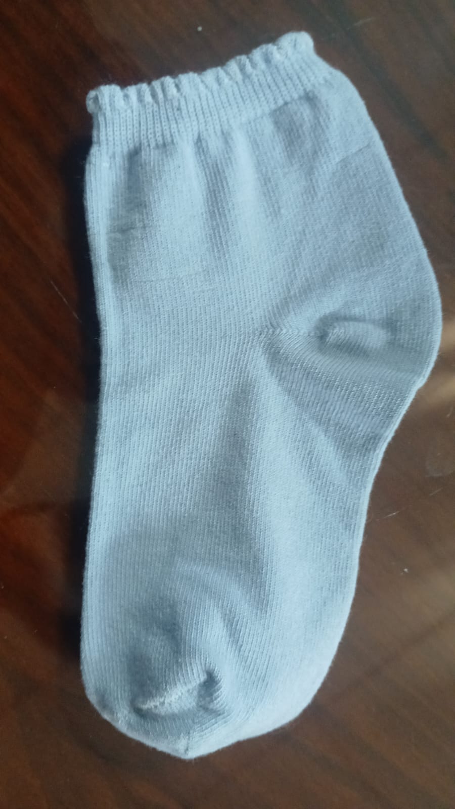 Single white ankle sock