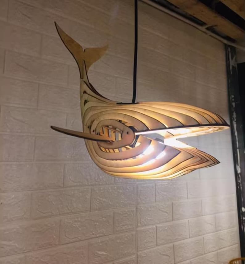Decorative wooden wall lamp in the shape of a whale