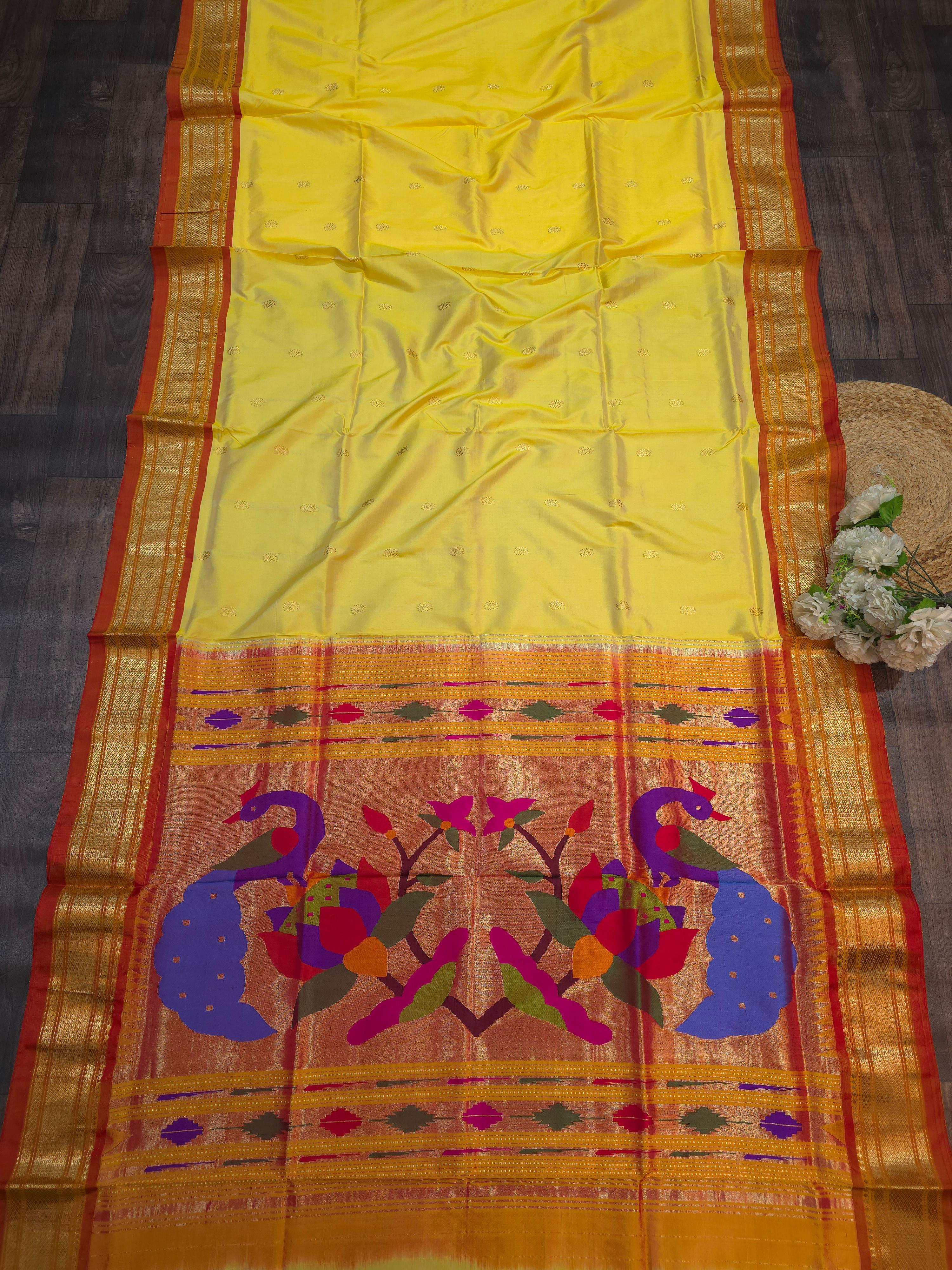Yellow Paithani silk saree with peacock design 25000/-