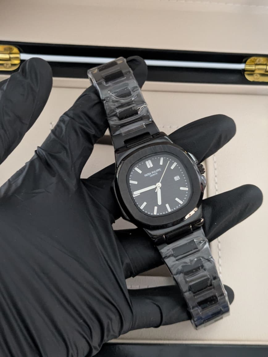 Patek Philippe Nautilus - Stainless Steel, Black Dial, Date and Master Lock