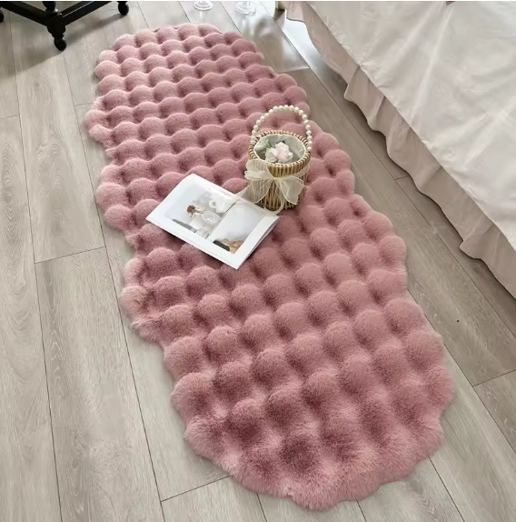 Bubble-textured pink plush rug
